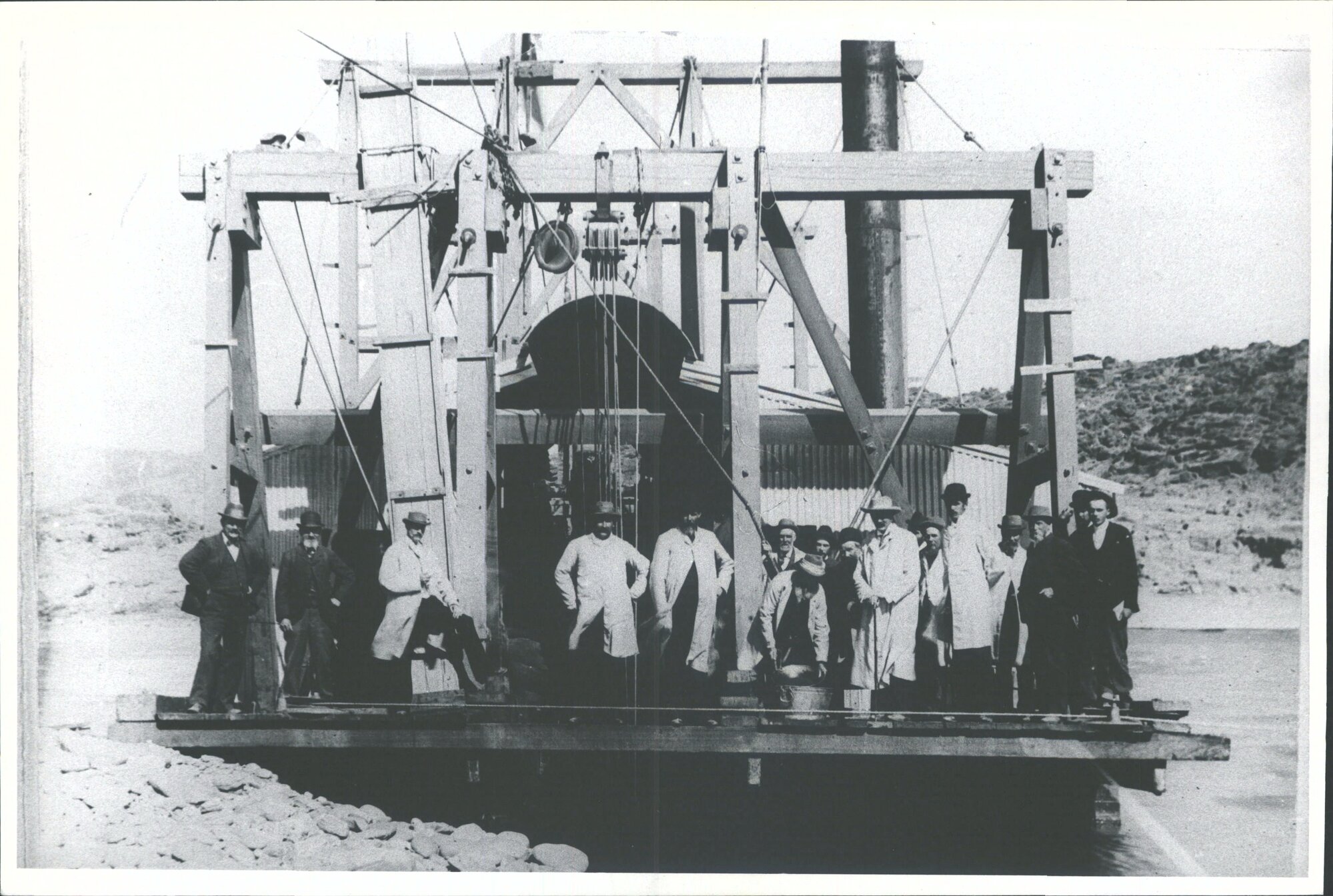 The first steam dredge built in Central Otago. Dr Hyde, chairman of directors in centre