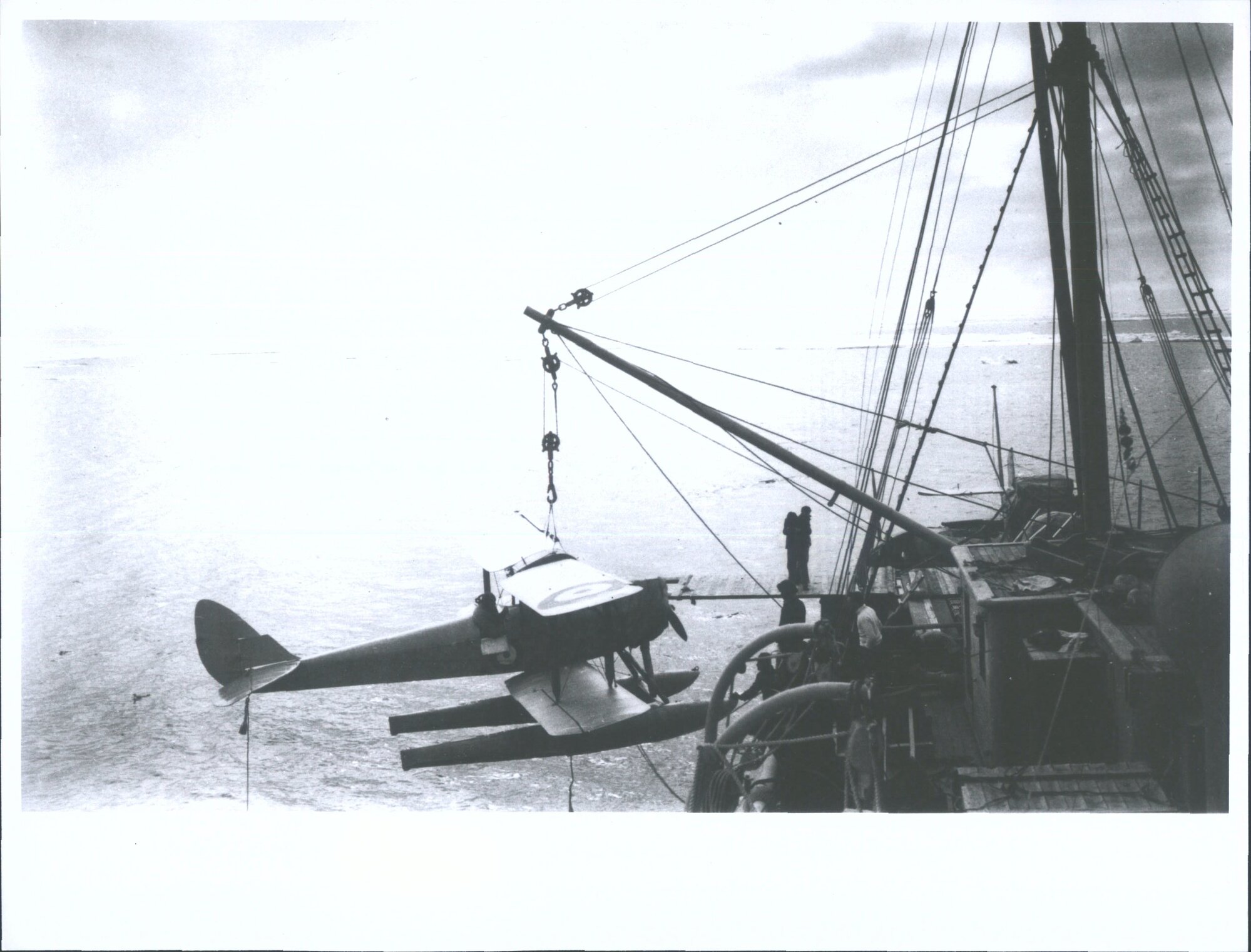 "Lowering the 'Moth' into the water for a flight to examine ice conditions