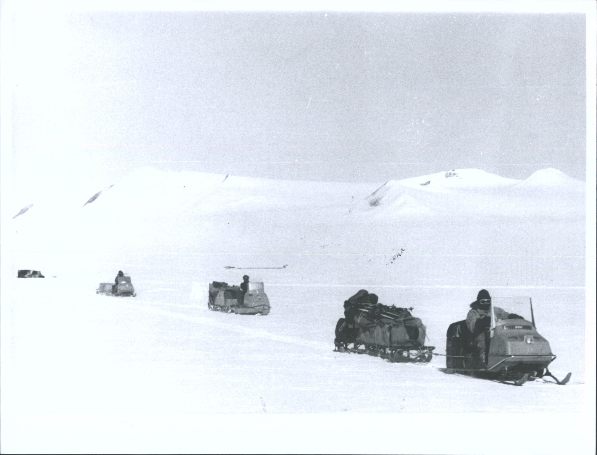 "A toboggan train sets out from a campsite in Northern Victoria Land"