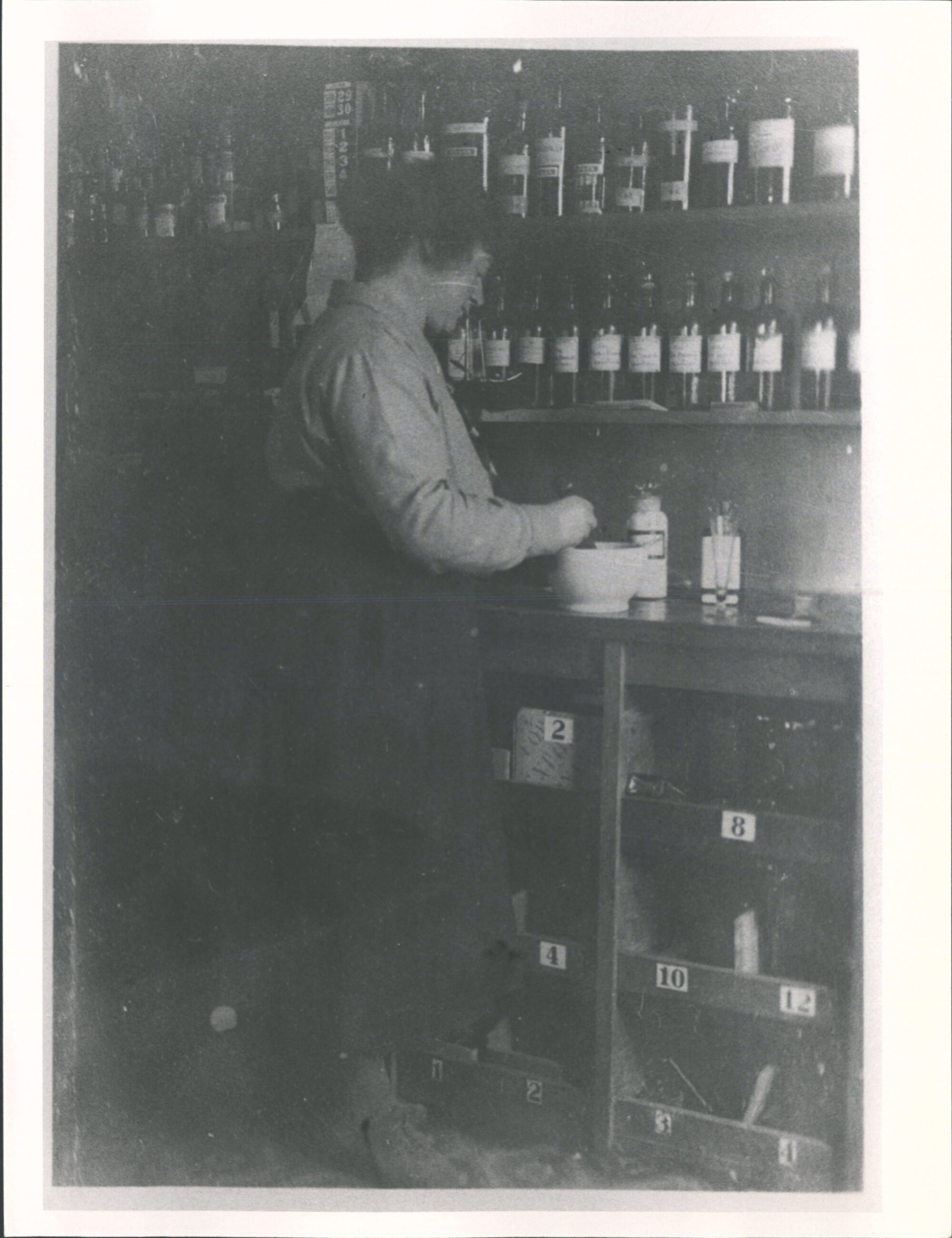 Mrs C. Sim in her father's pharmacy