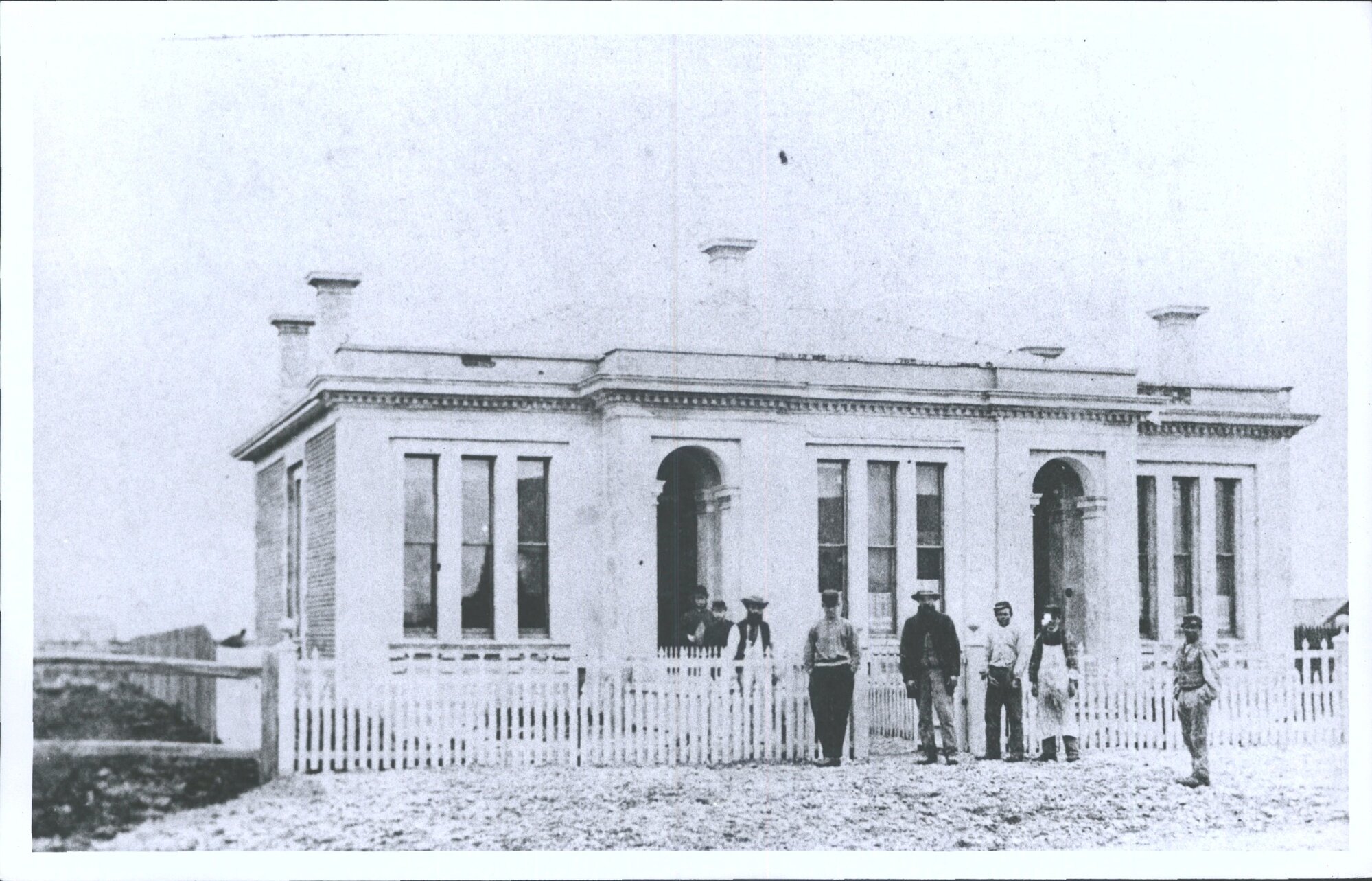 [Men outside building]