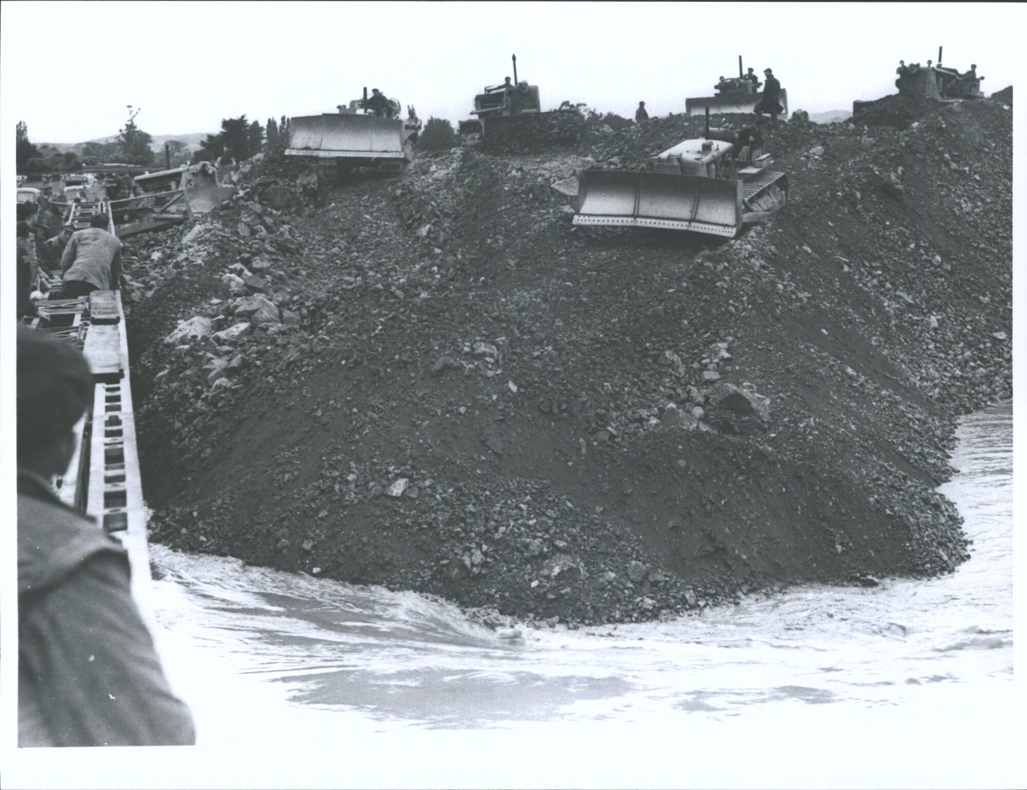 Bulldozers filling the gap