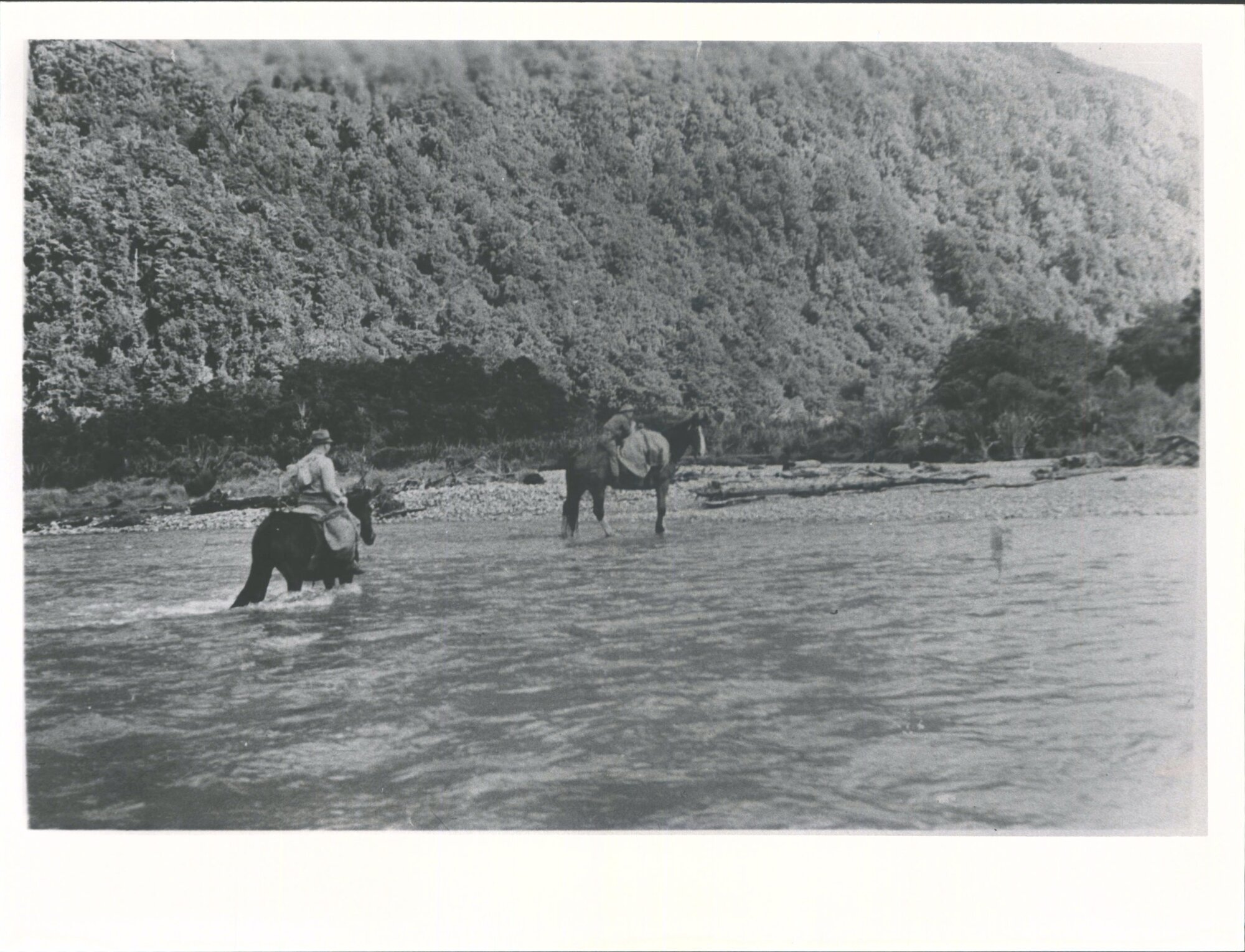 Men on horseback crossing Barrier River