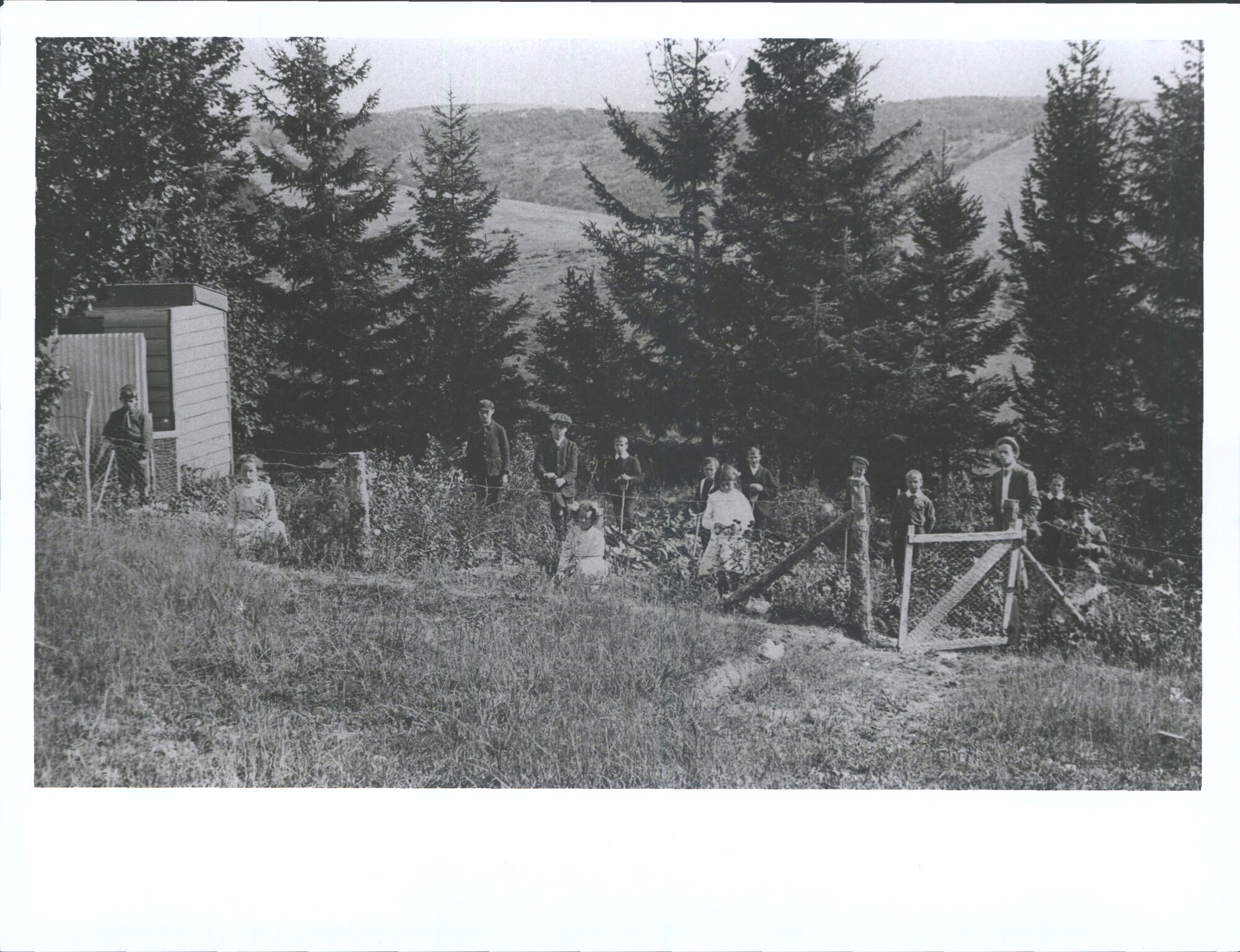 Mr Miller H.M. with Senr. Pupils in School Garden.