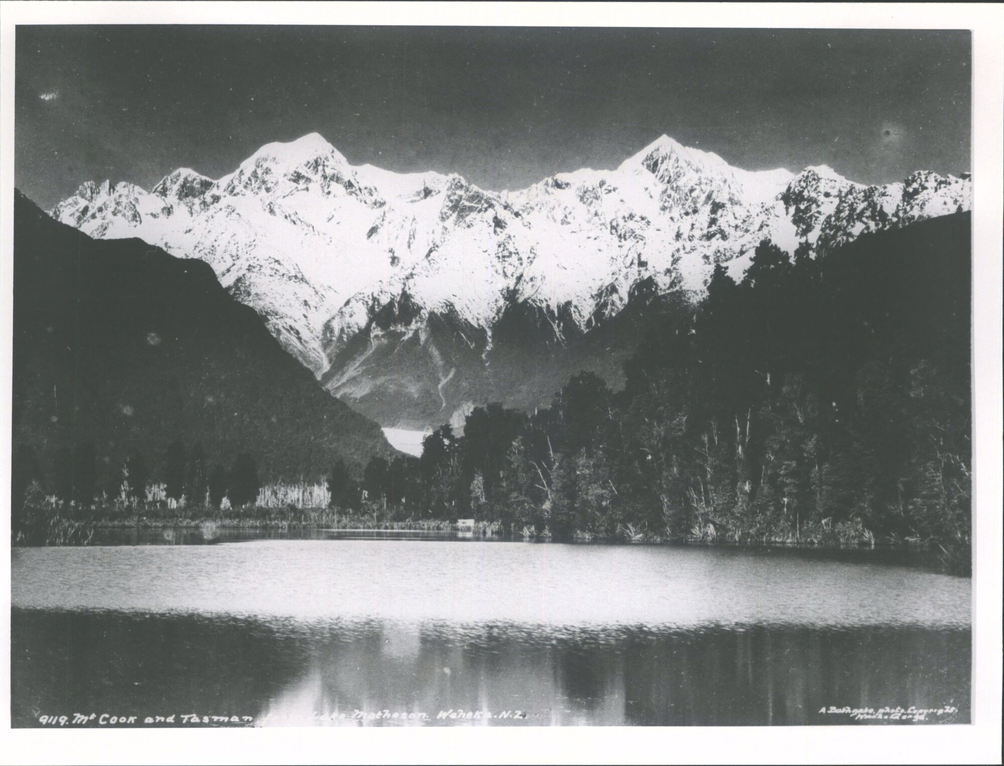 Mt Tasman (left) and Mt Cook (right) from Lake Matheson, West Coast