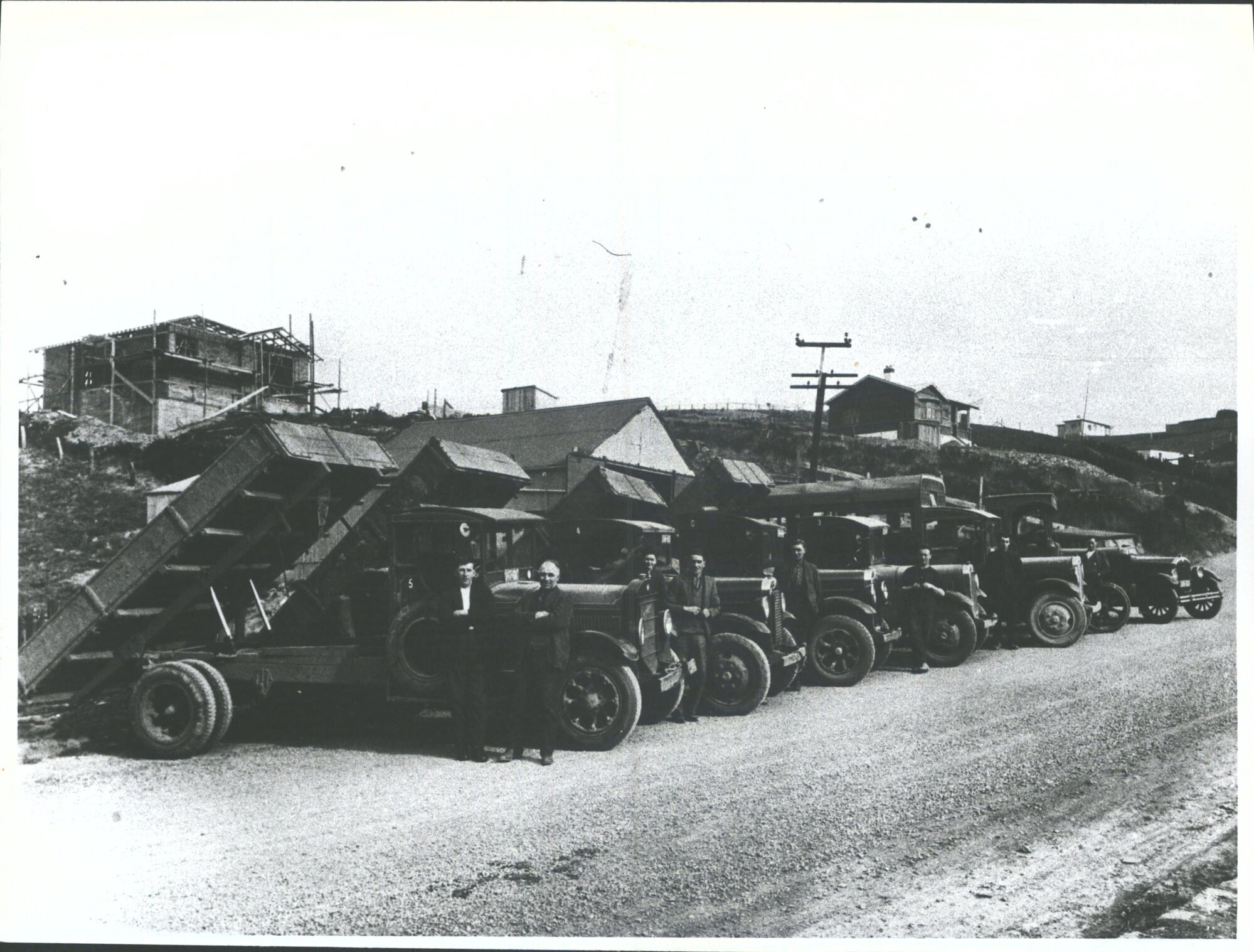 Harry McKay with fleet of trucks, Main South Road, Caversham