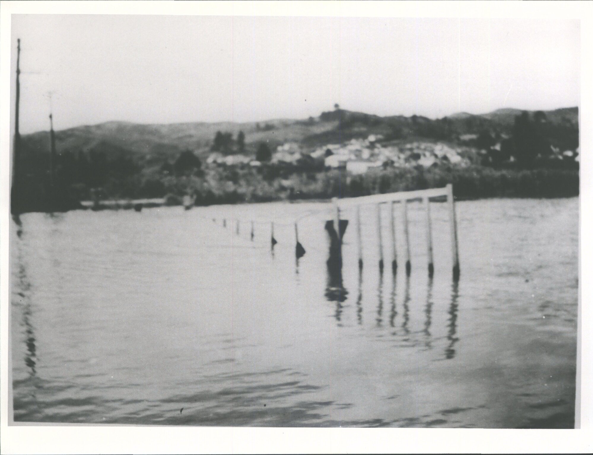 [This is the Swing bridge made of planks which was in front of and the access to Mr Chas Stokes farm of kai.]