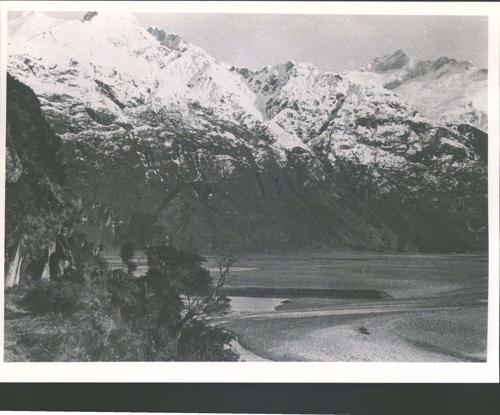 From Niger Bluff (before road in 1939) looking across riverbed to Mt Aspiring homestead
