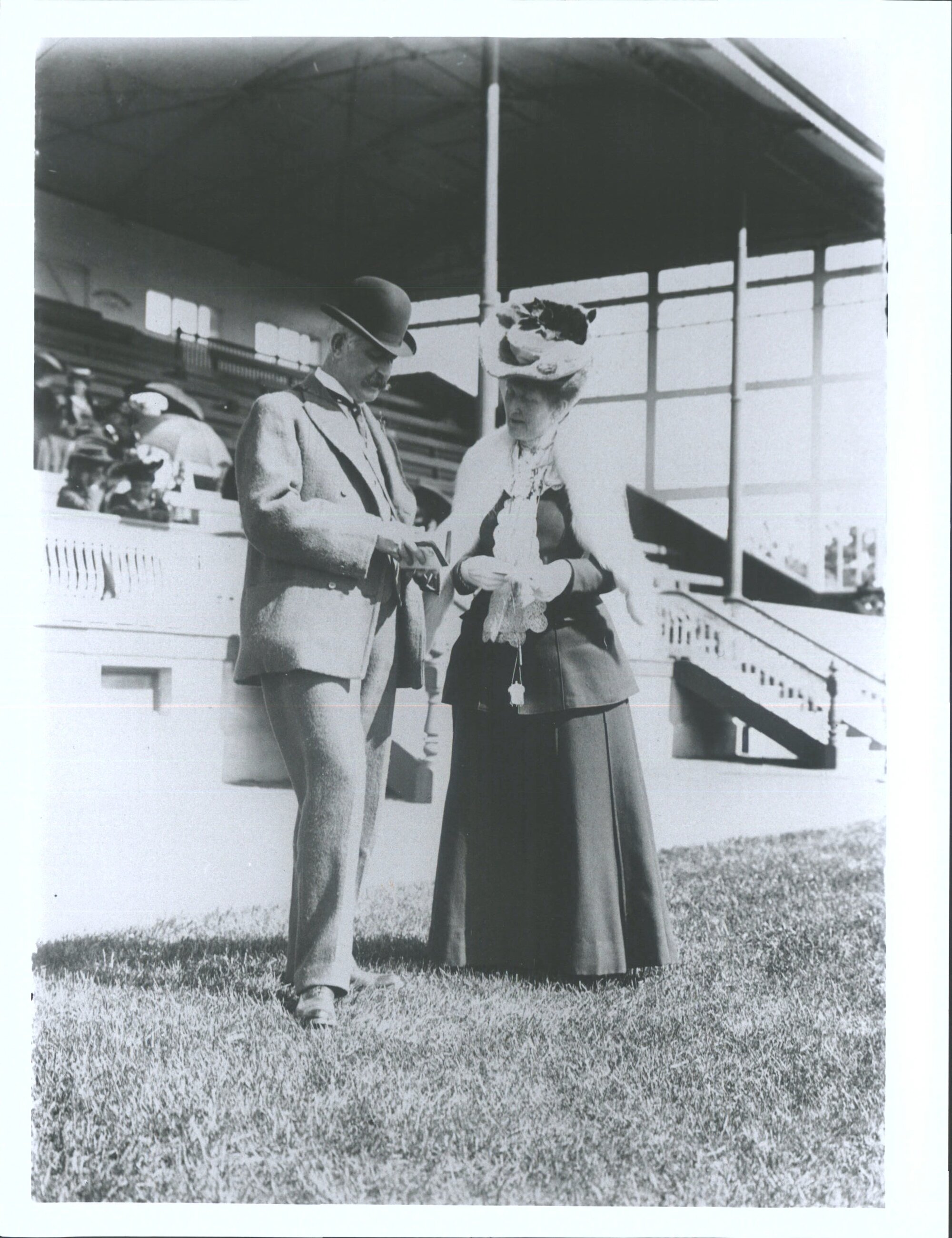 Comparing notes'. A snapshot in front of the [Wingatui] grand stand