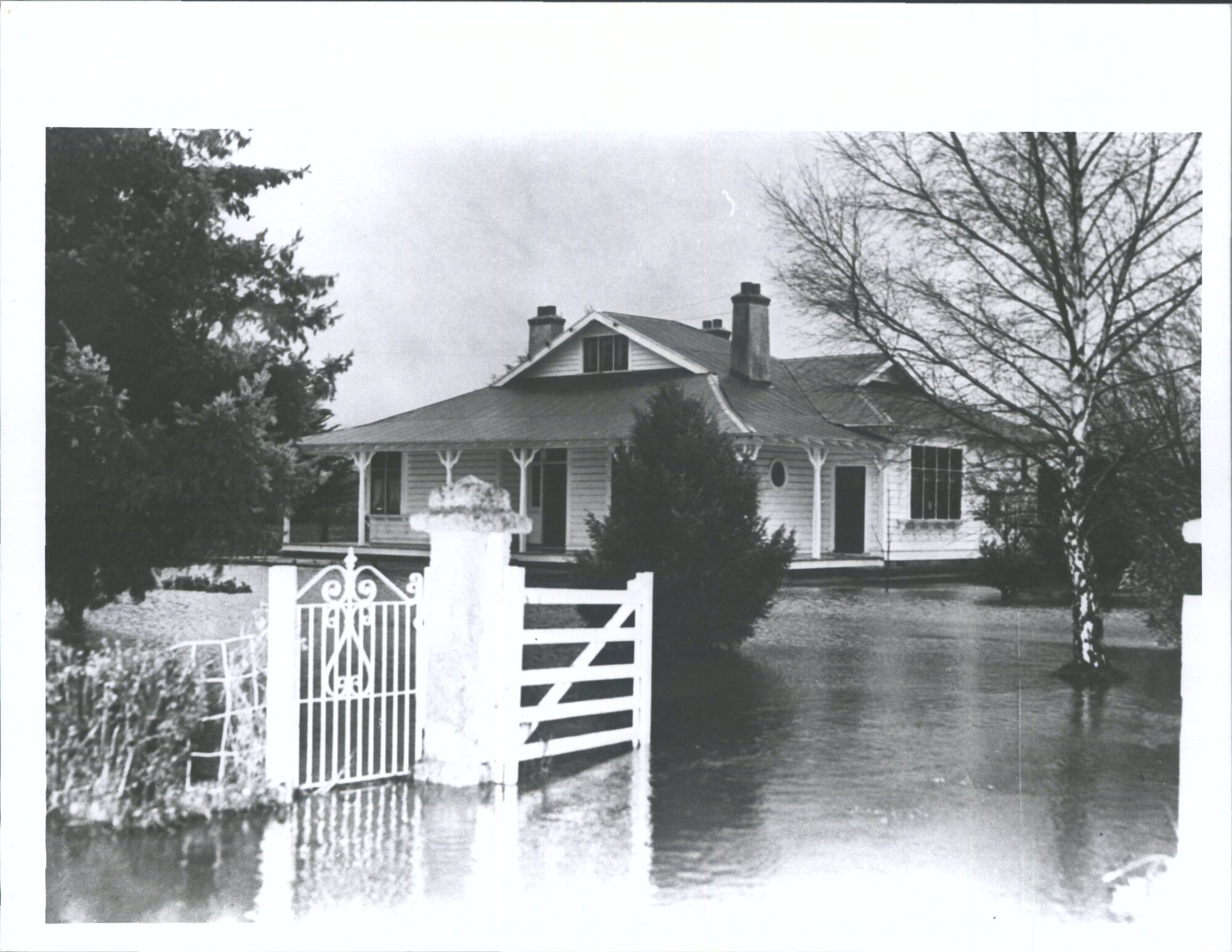 "Farmstead on junction of Mosgiel and Outram roads completely surrounded by flood waters"