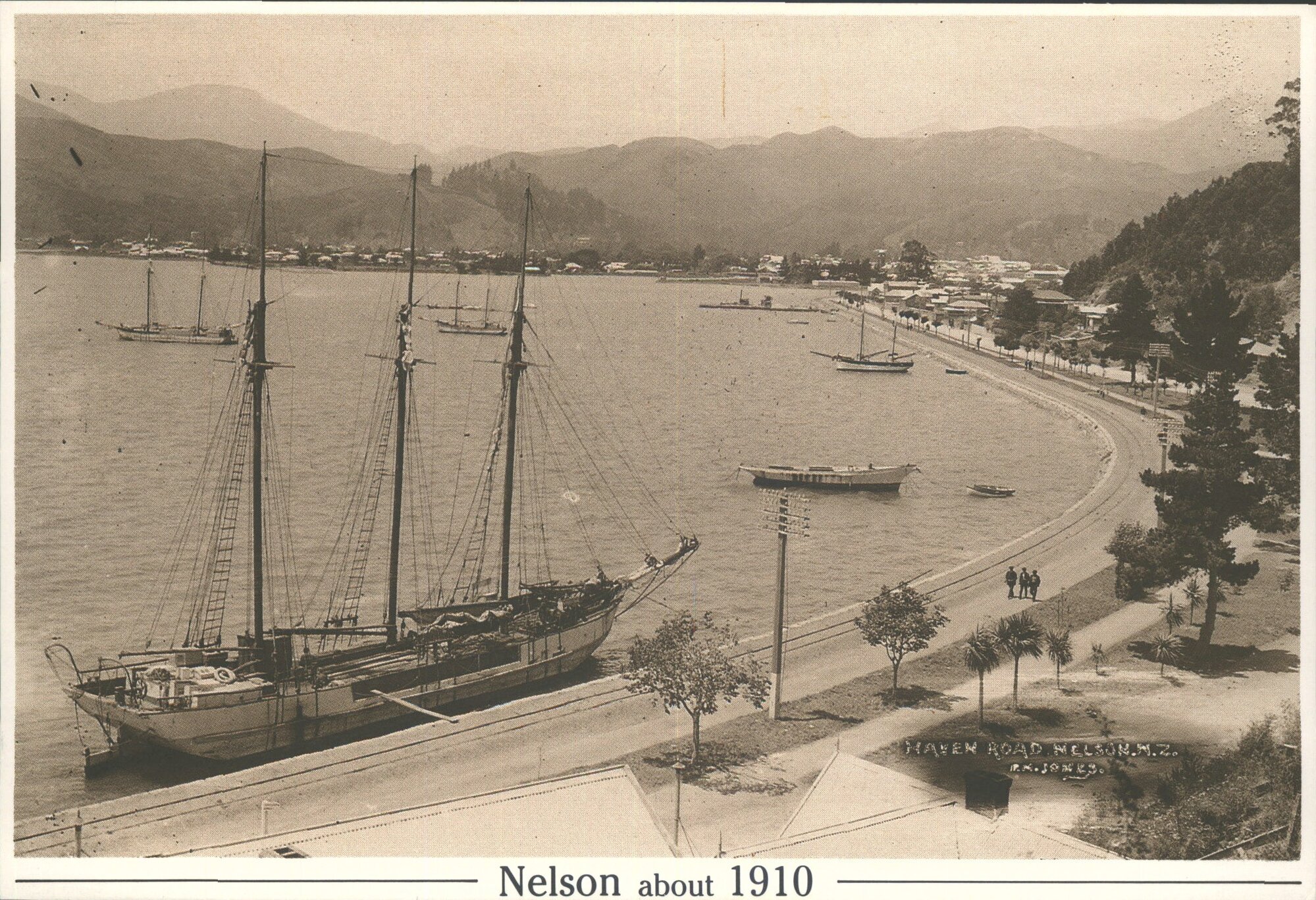 Haven Road, Nelson NZ, about 1910, looking towards the city. Coastal traders are afloat on the high tide, but all of the Haven v