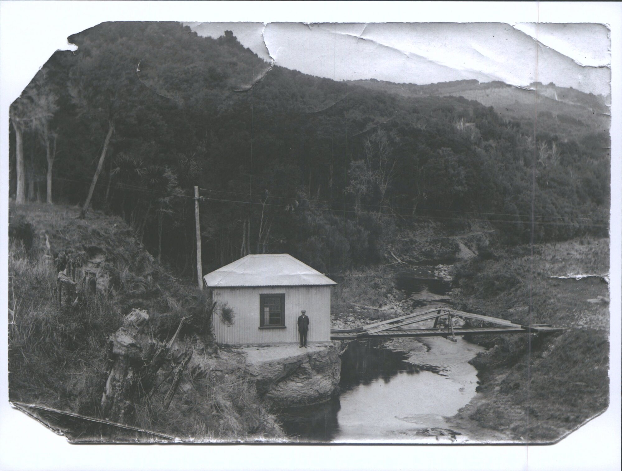 Whare Flat house and river