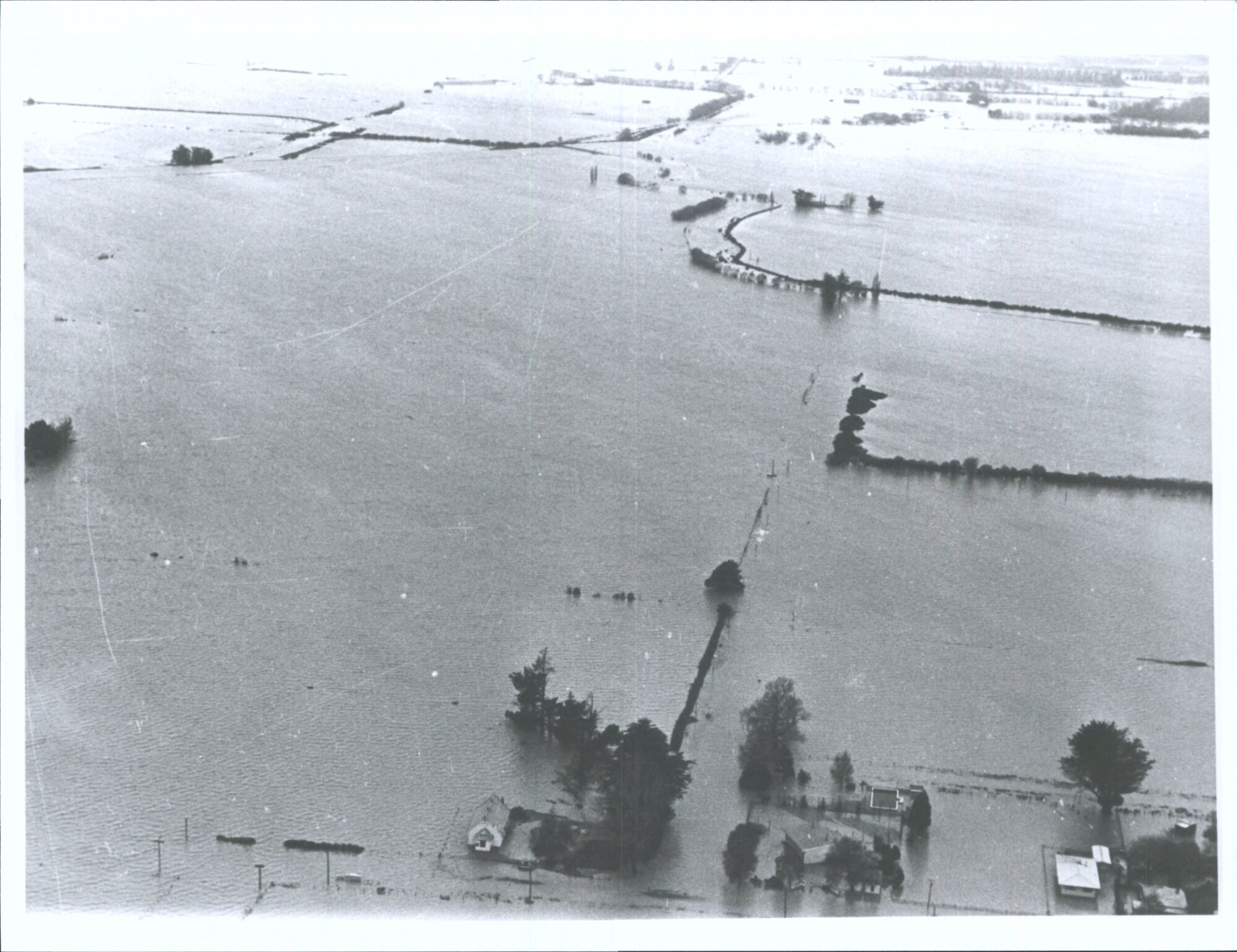 Aerial photograph of flooded farmland and houses