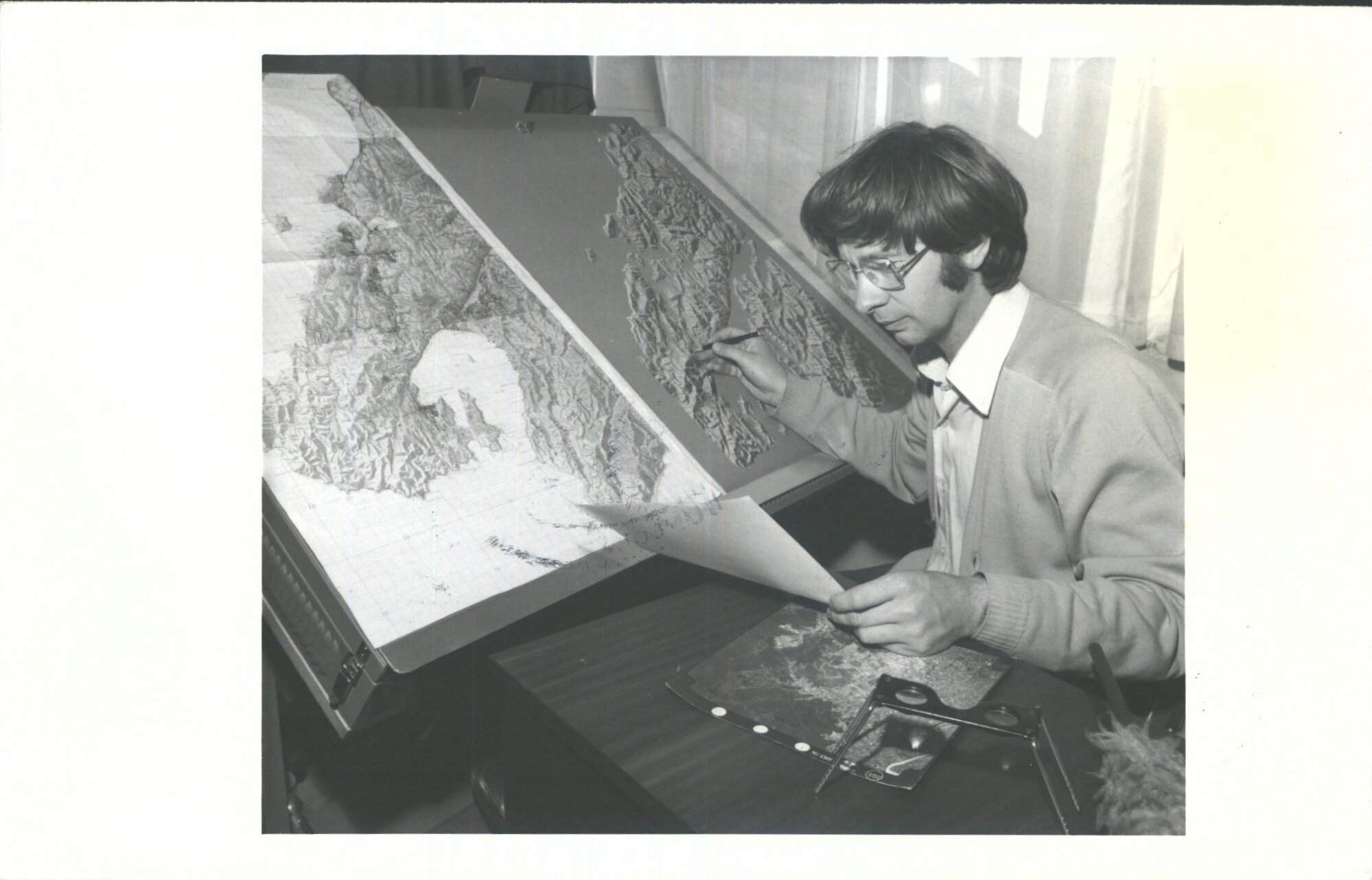 Mr D. LAWRENCE, Specialist in relief shading at work on map of the Wellington area