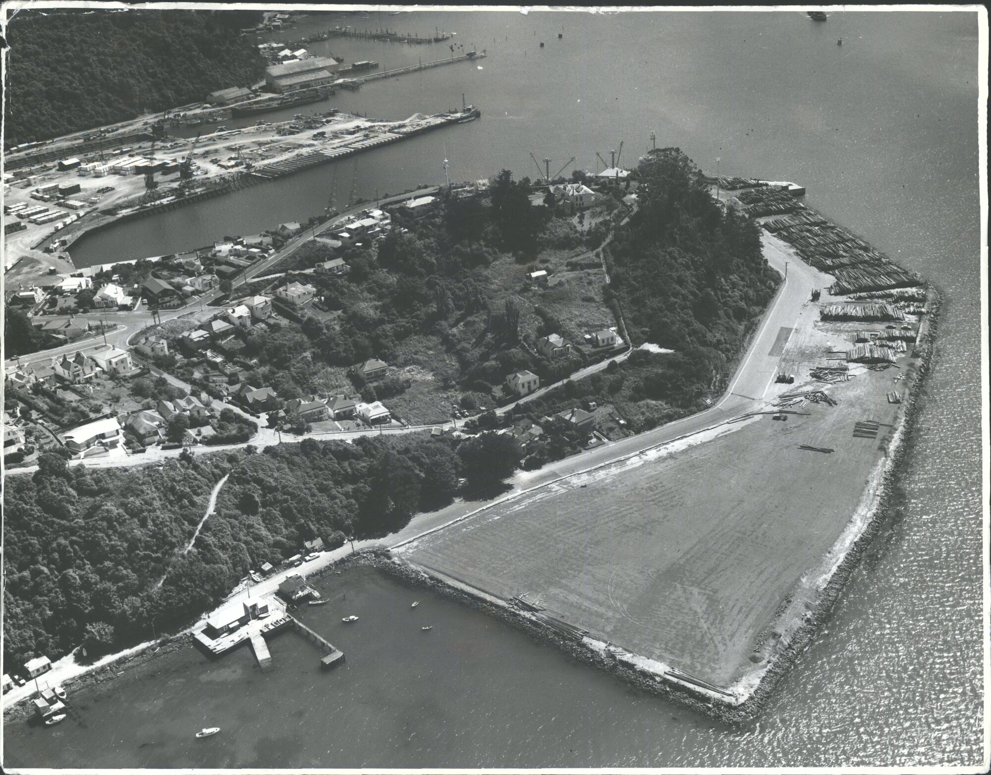 Reclamation of the Otago Harbour Board's log-stacking area at Port Chalmers has been completed. In the area at right logs for ex