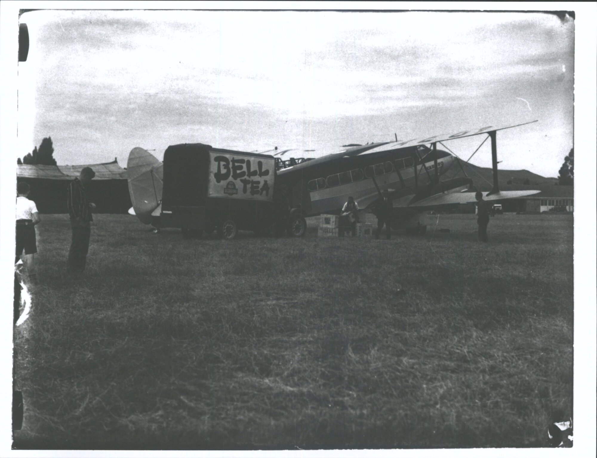 ZK-AEG De Havilland D.H.86 "Karoro" with Bell Tea truck, loading first cargo going abroad