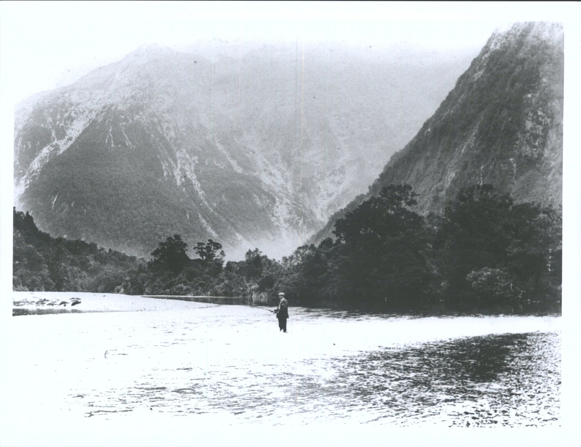 Unidentified man fishing in the Waiau River