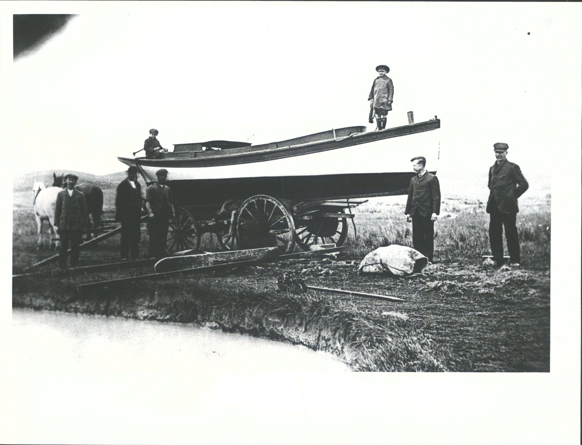 Launching Motor Boat used to tow coal barge to Dredge