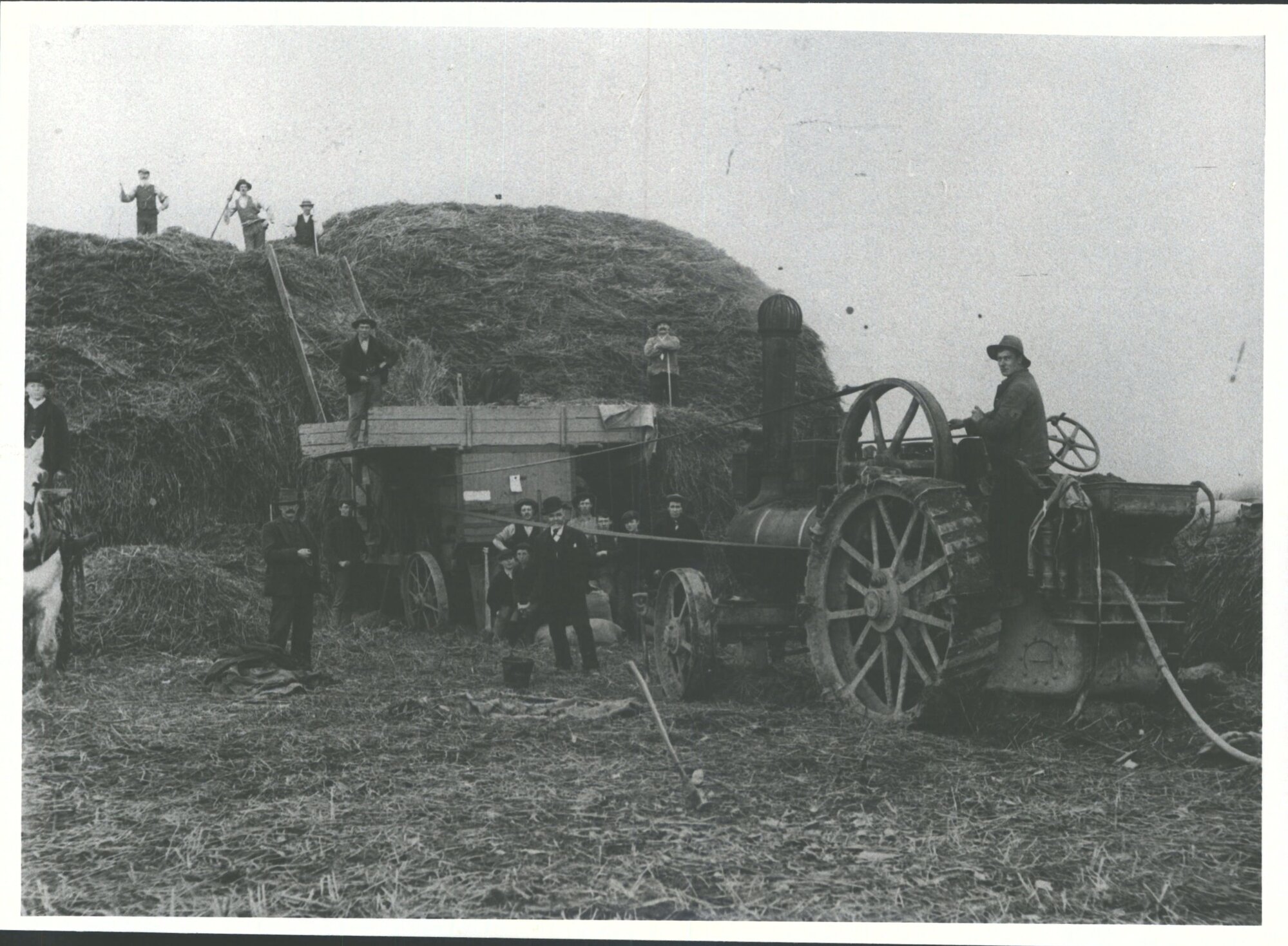 Smith's Traction Engine &amp; workemen at Holm's stacks with threshing mill