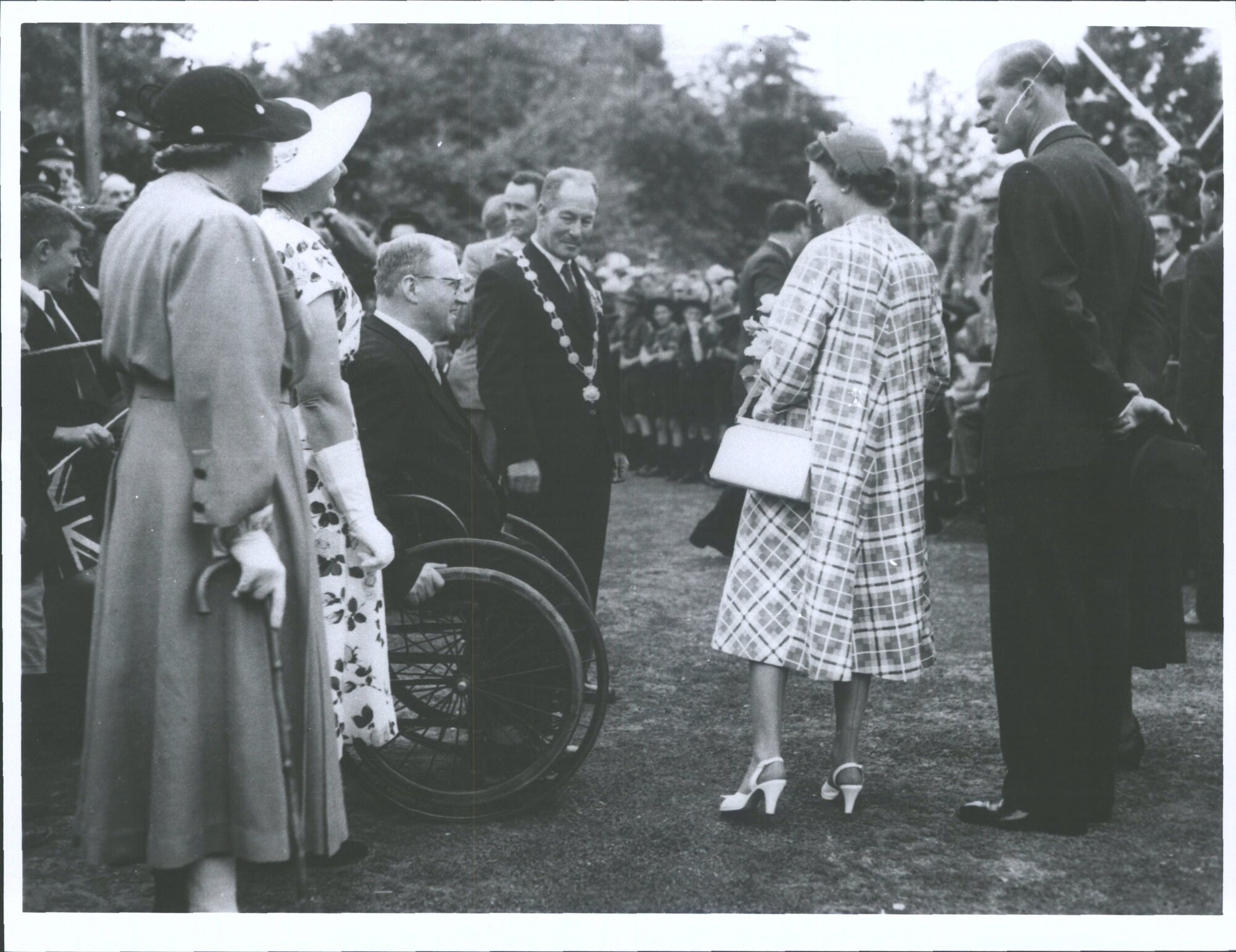 Masterton. Mayor E G Coddington introduces Mr V. MacFarlane-Laing (in wheelchair) to Q. E. II and Duke of Edinburgh