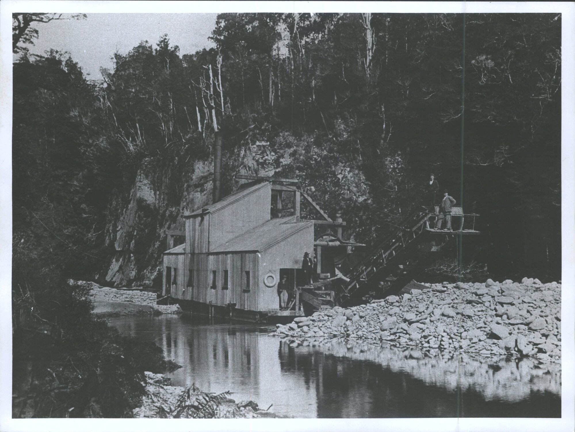 Men standing on dredge