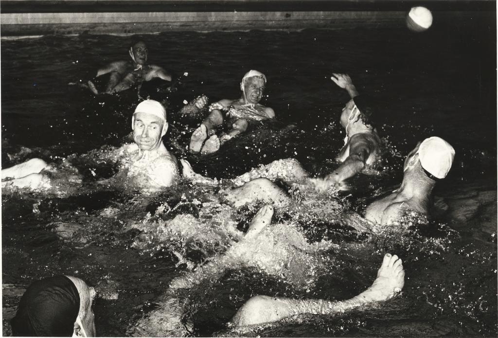 Group playing water polo