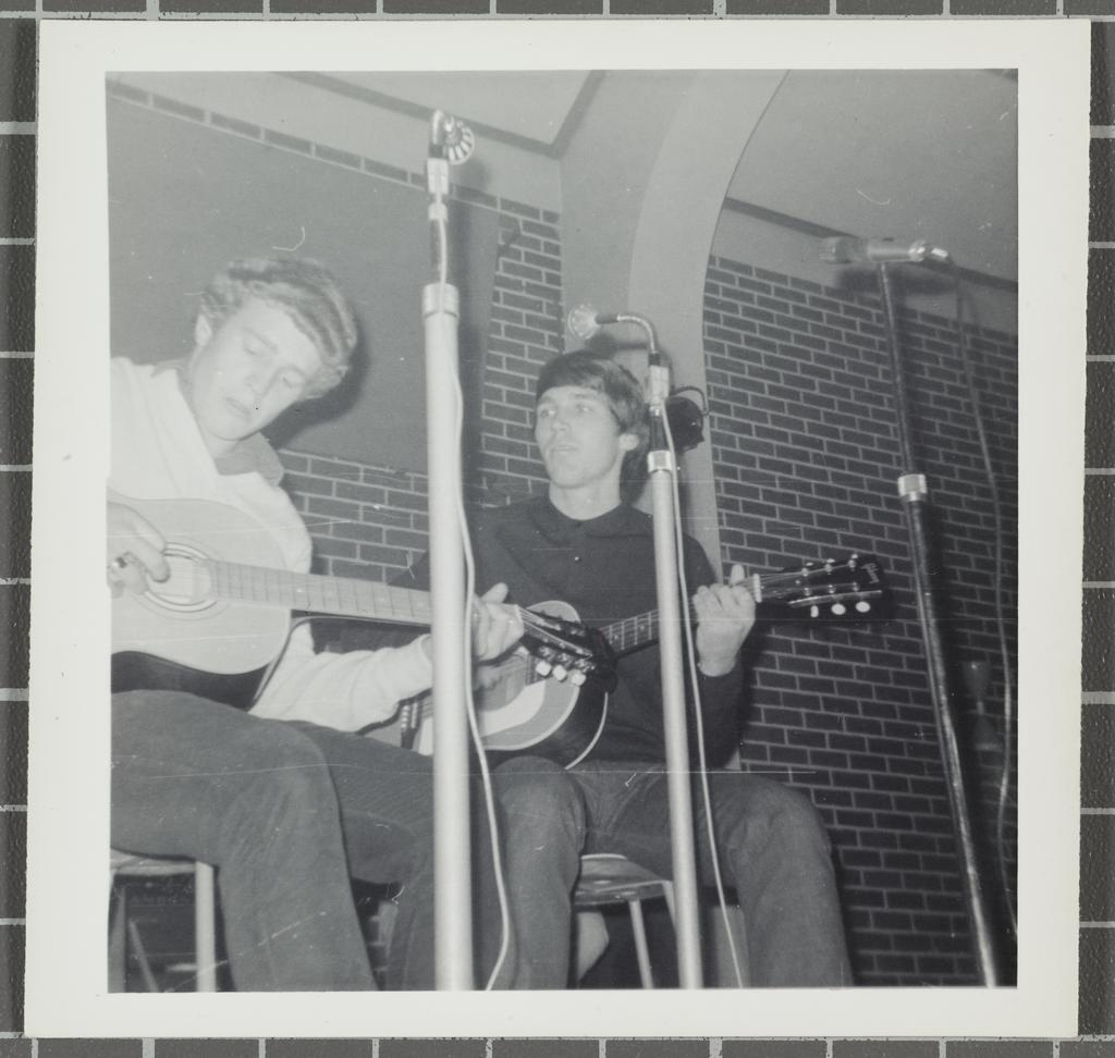 Duo with guitars performing at the 'Folk Proms Concert Capping '67', Union Hall, Dunedin
