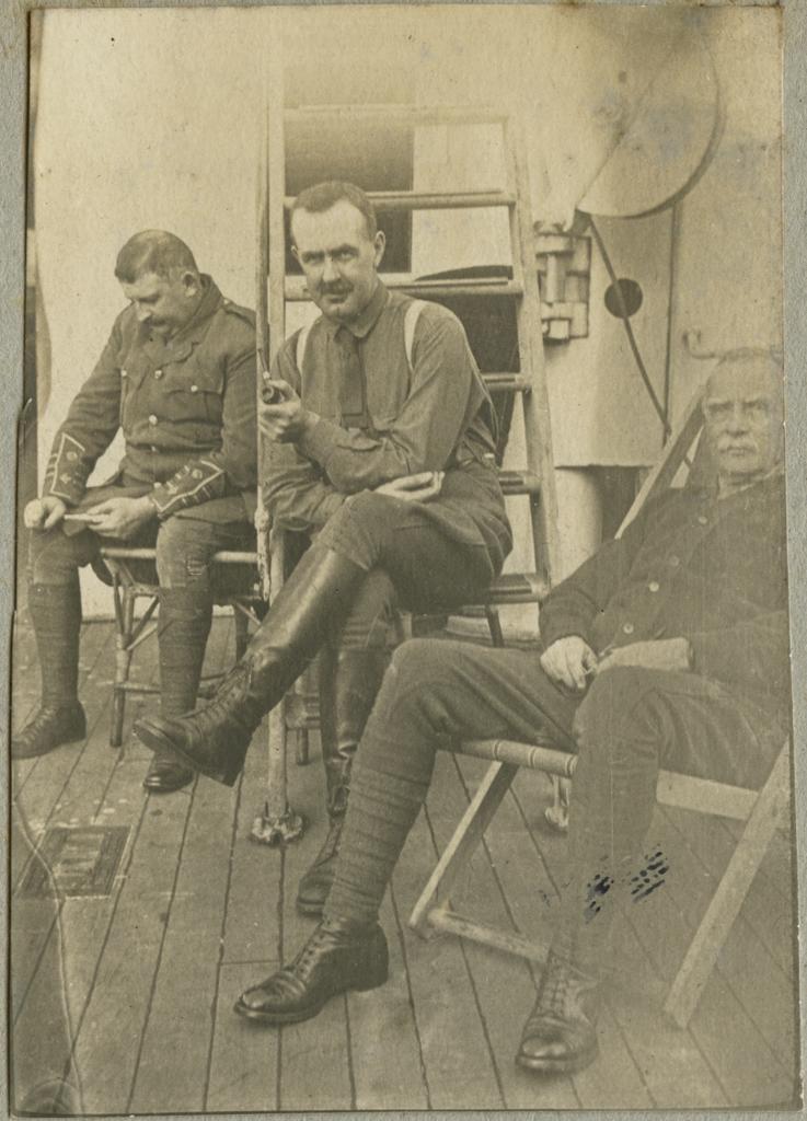 Charles Mackie Begg and two other men on HMNZHS Maheno