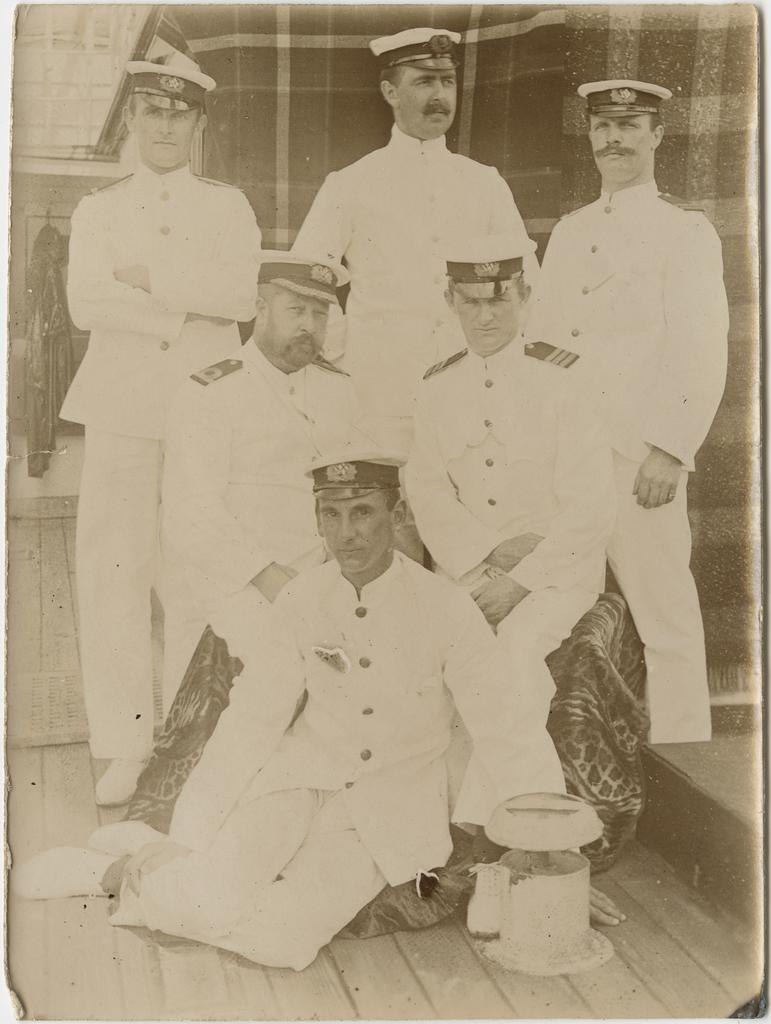 Six men in naval uniform