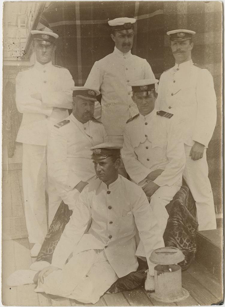 Six men in naval uniform
