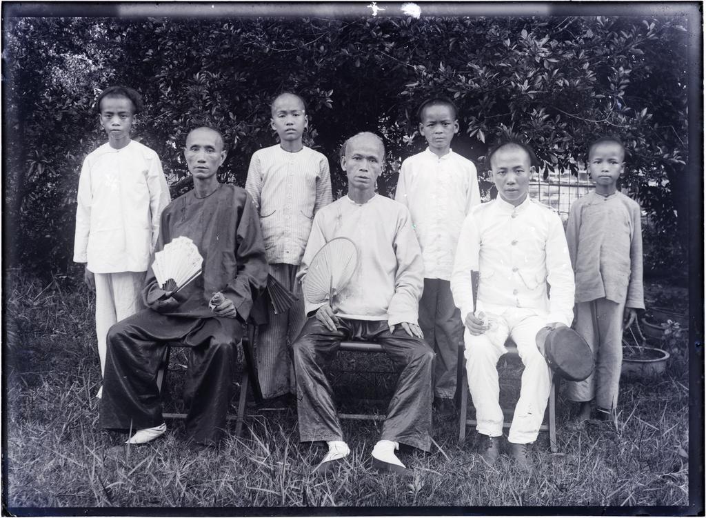Group of Chinese men and boys in summertime - students in the college