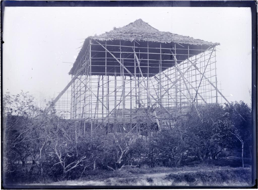 Mat house being built in orchard