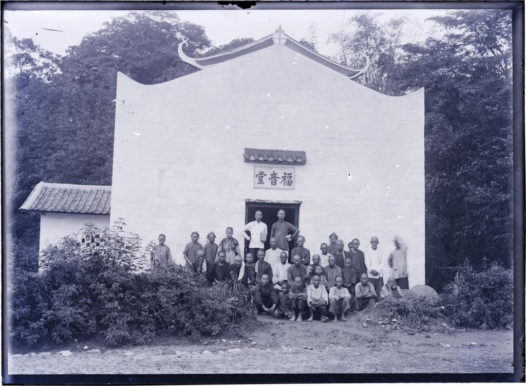 A group of people in front of chapel