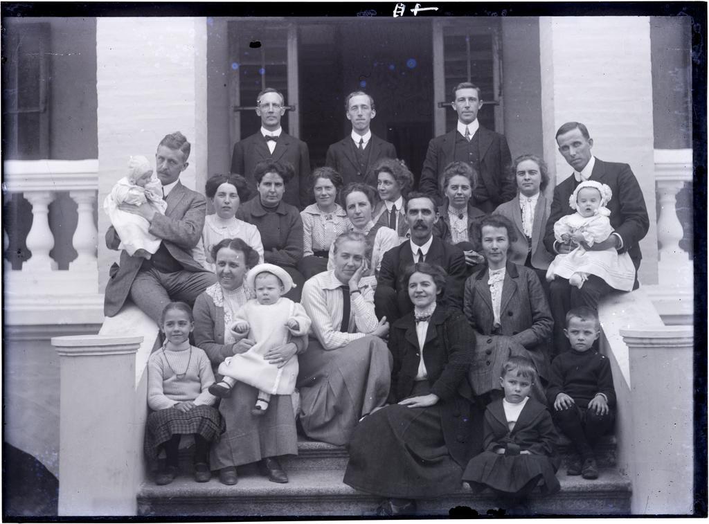 A group of European people on entrance steps