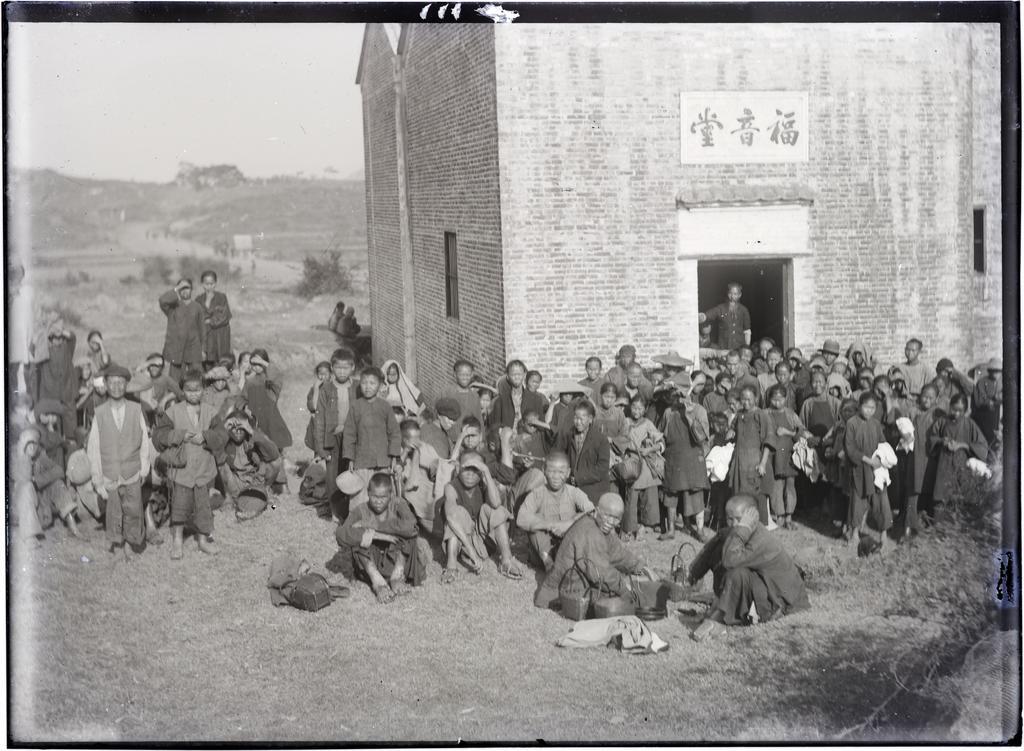 Brick building with people who attended service