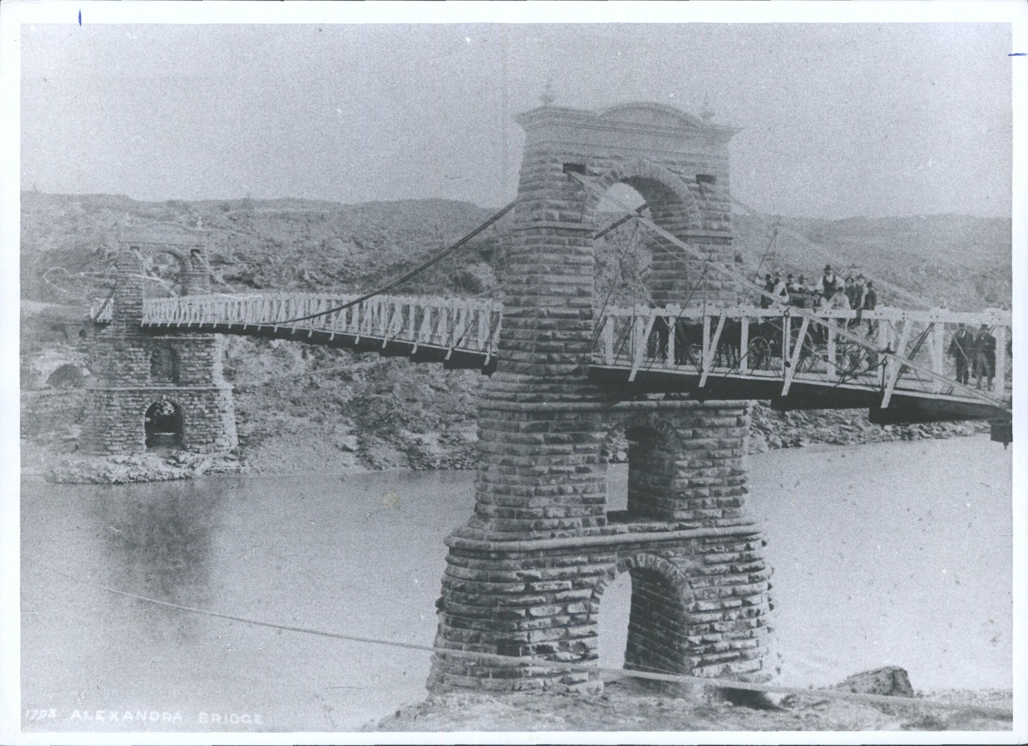 [Horse drawn cart going over bridge]