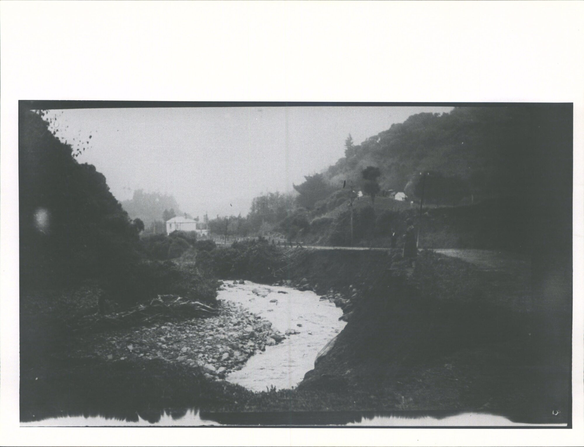 Another washout about halfway up   just where the road enters the hills there was a shop below the large white house you can see