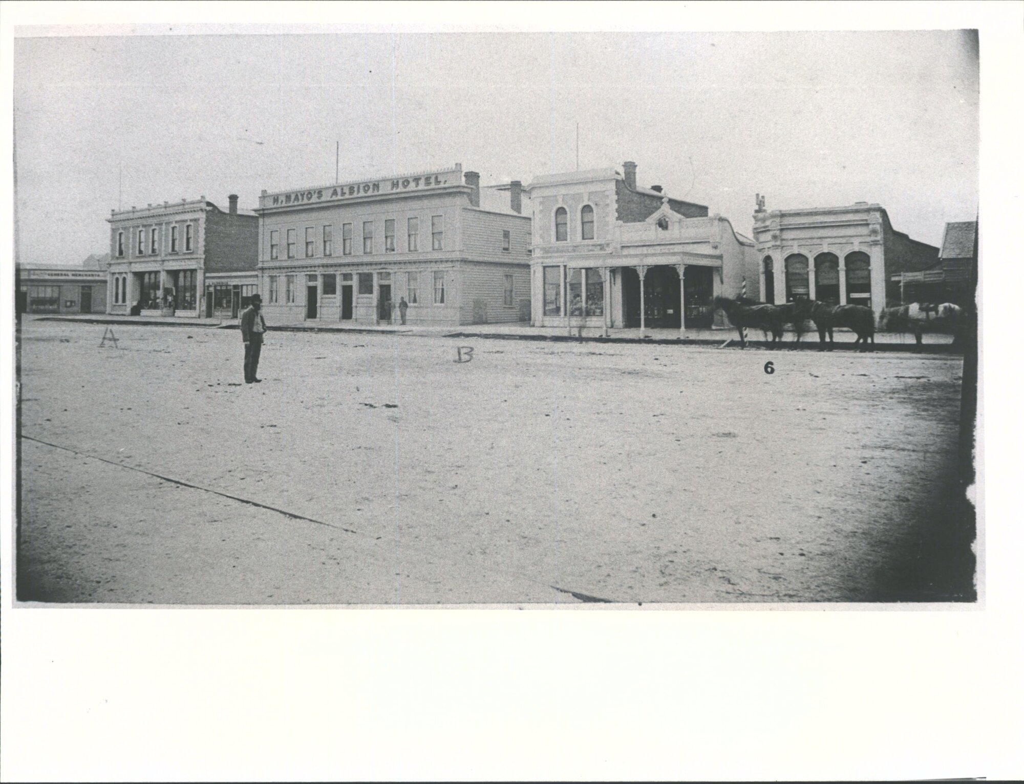 Showing Lewis's Corner and the second Albion Hotel.  Photo of Buildings destroyed by late fire in Invercargill &amp; since rebuilt
