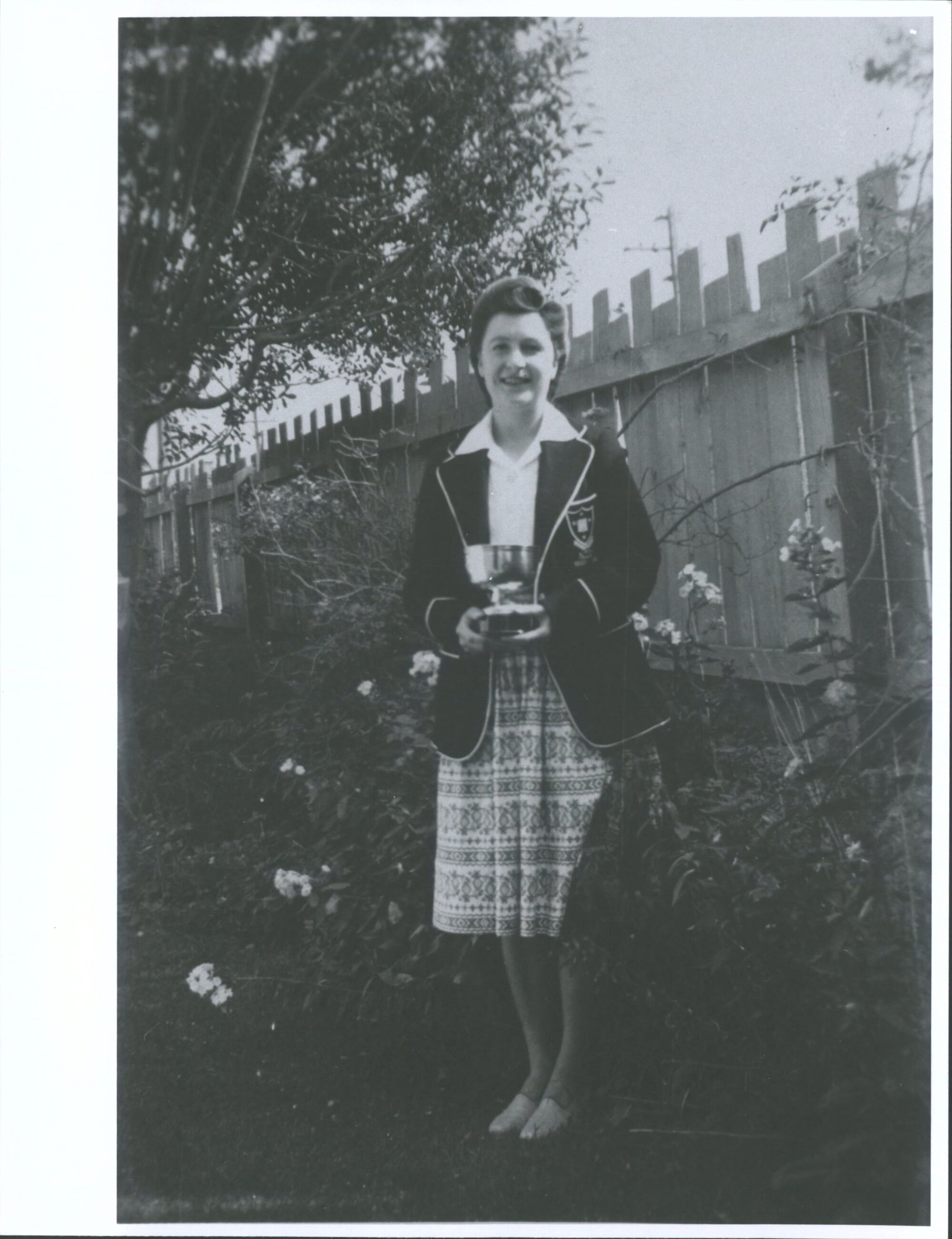 1947 Kathleen Watt holding Dawson Cup for athletics