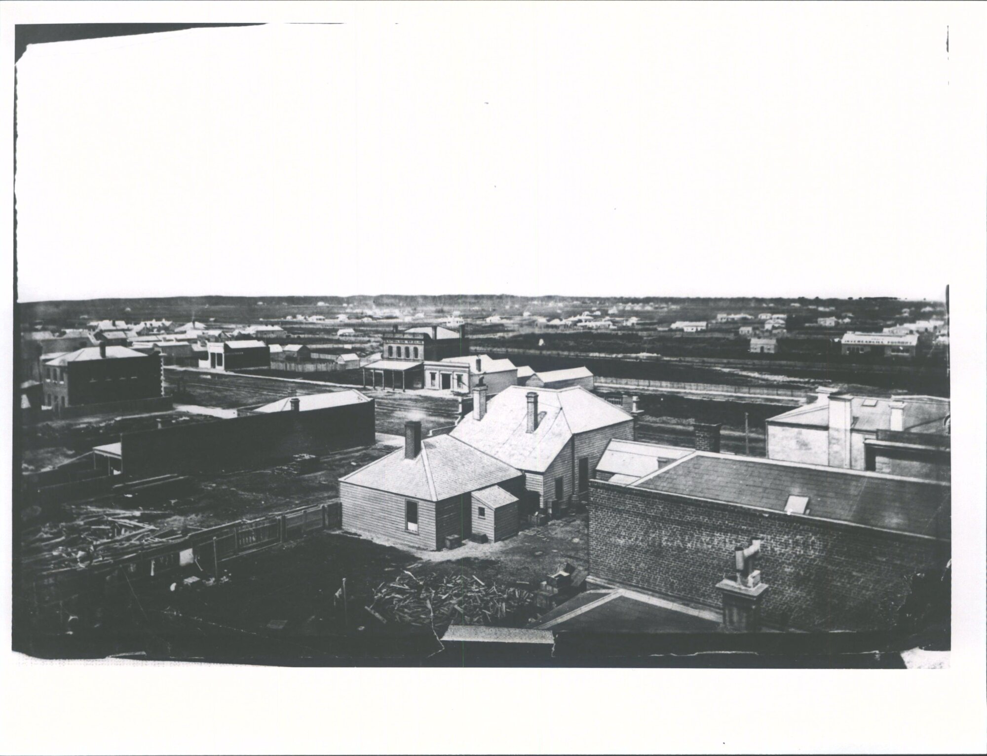 Building with verandah is National  Bank