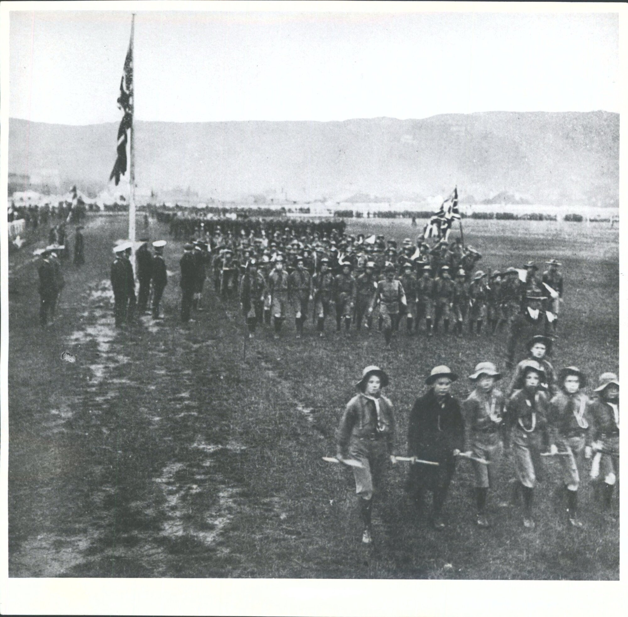 Caption: 'The March Past: Lieut.-General Baden-Powell at the saluting base. Here the boys were inspected as they marched past to the music alternately of the band and of the Albany Street School fife and drum band