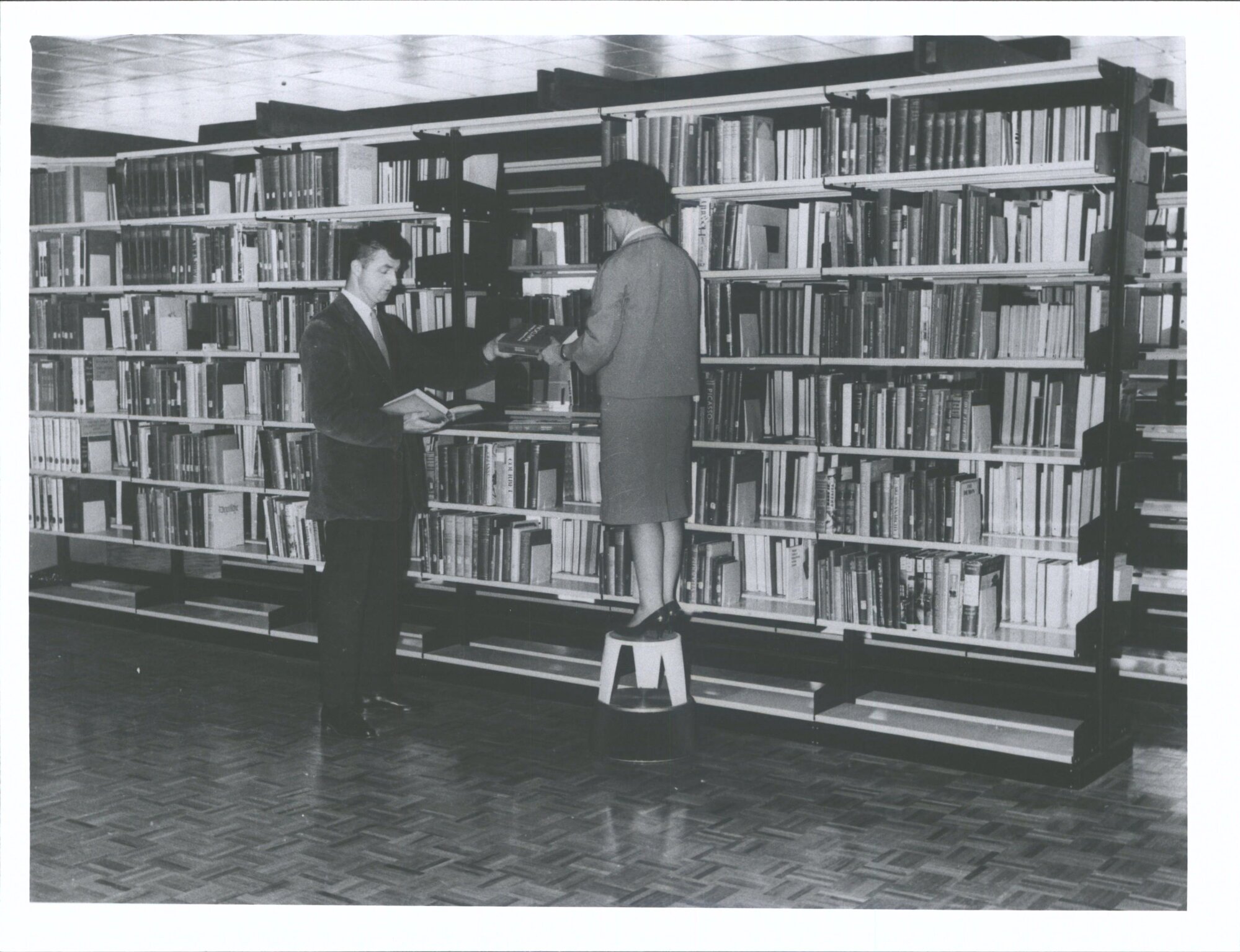 Book Stack, First floor (left. Richard W. Hlavac, right: Miss E. Robinson).