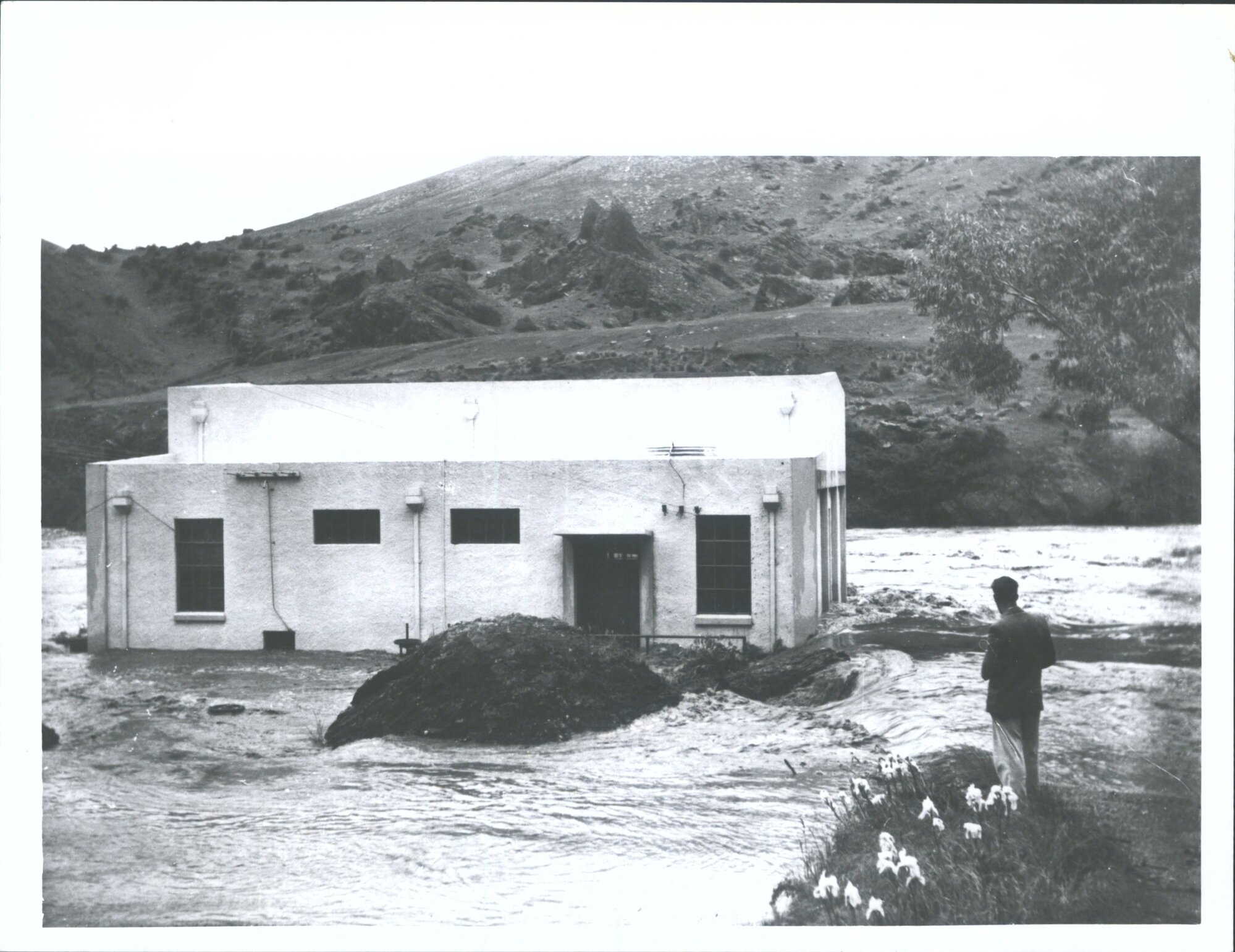The Roaring Meg power station stands isolated by the unprecedented flood in the Kawarau River near Cromwell. Three feet of water