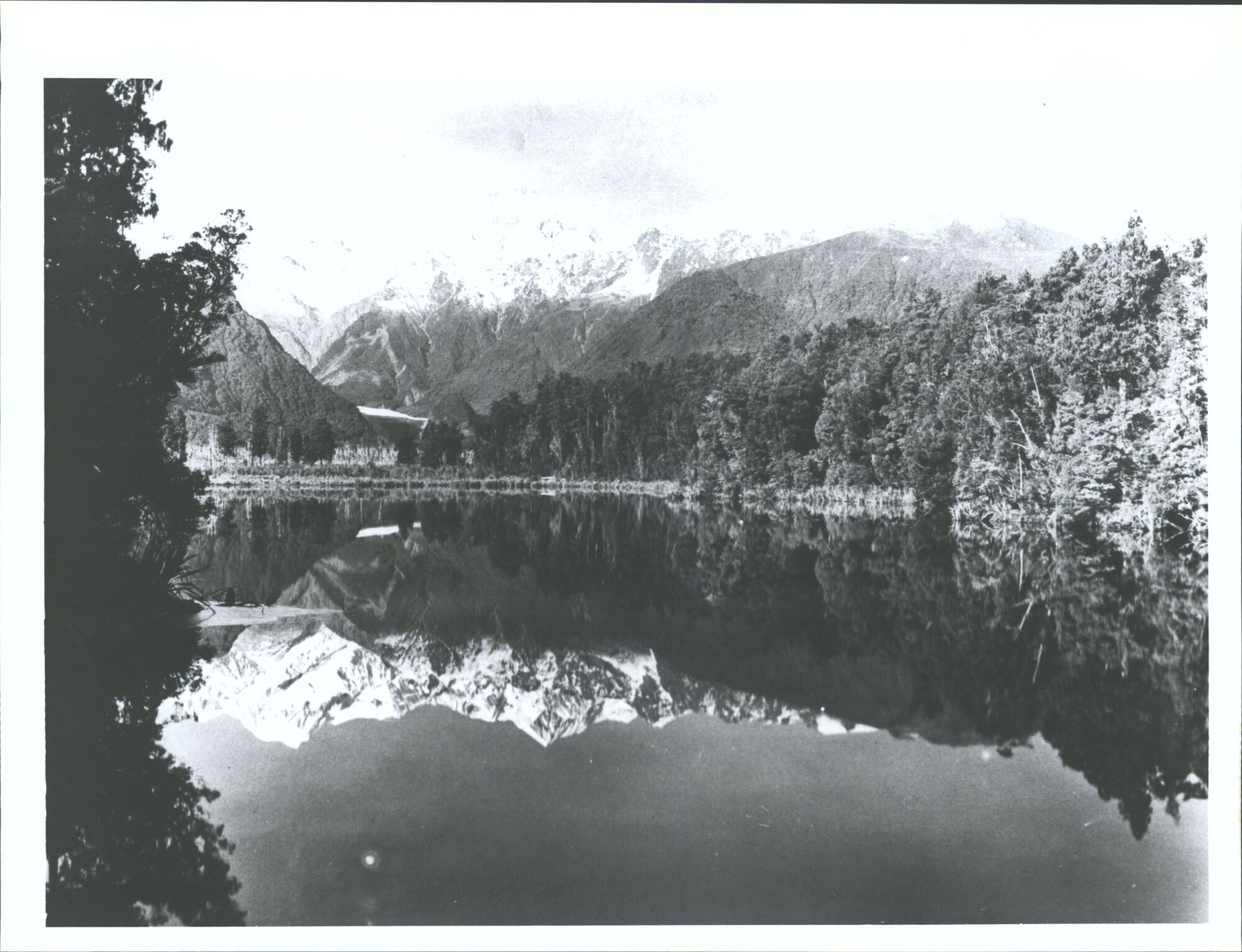 Mts Tasman &amp; Cook reflected in Lake Mathieson Sth Westland