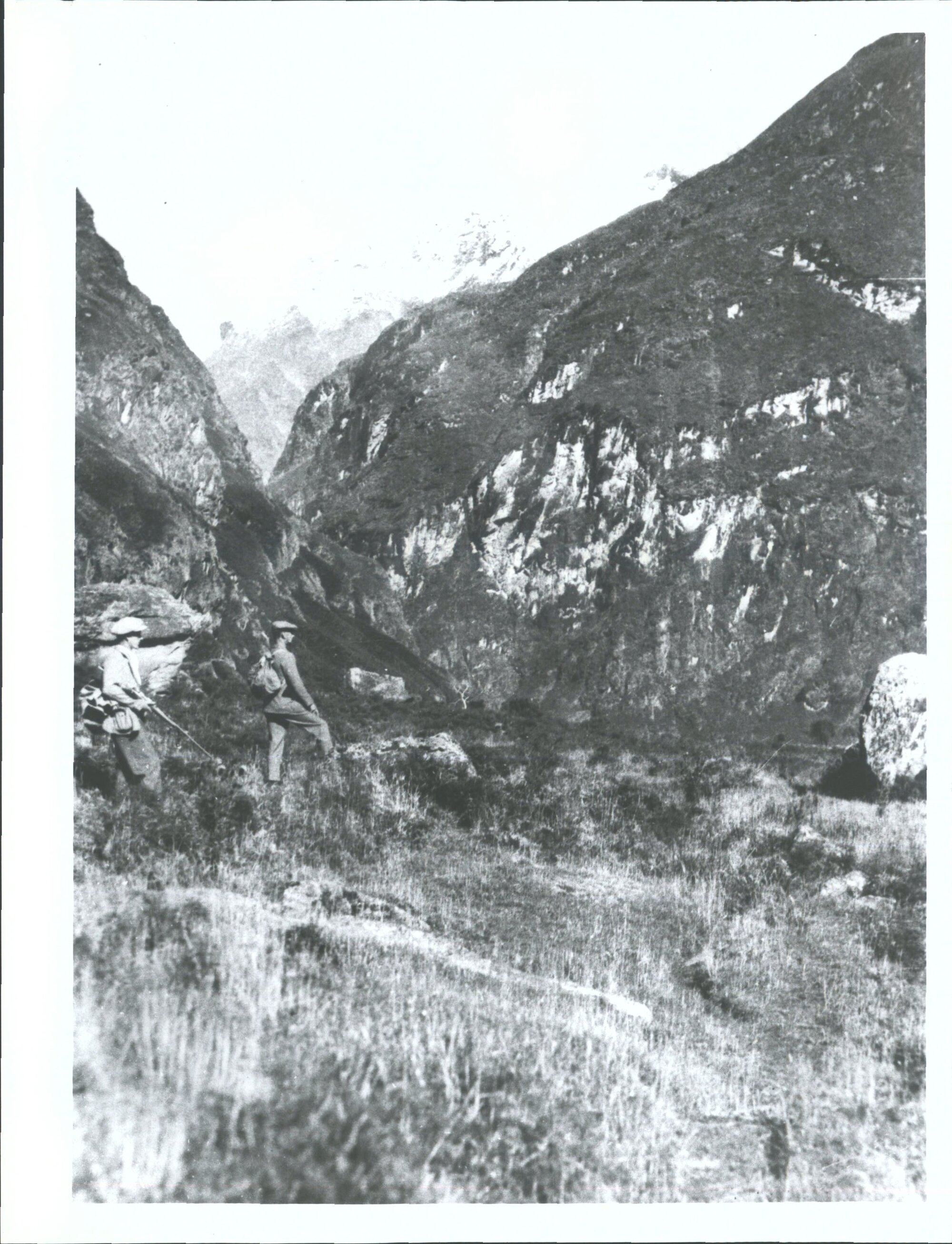 "Though surrounded by rugged mountains the tramper may approach the valley by an easy walk over level country. Near Mt Niger."