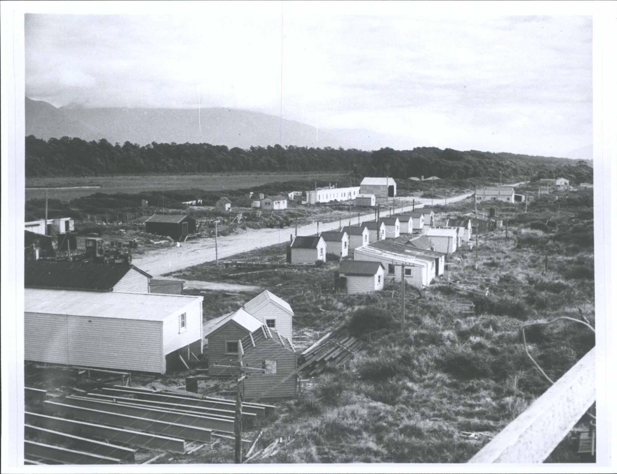 "Ministry of Works workmen's huts and yard at Haast Settlement, looking south"