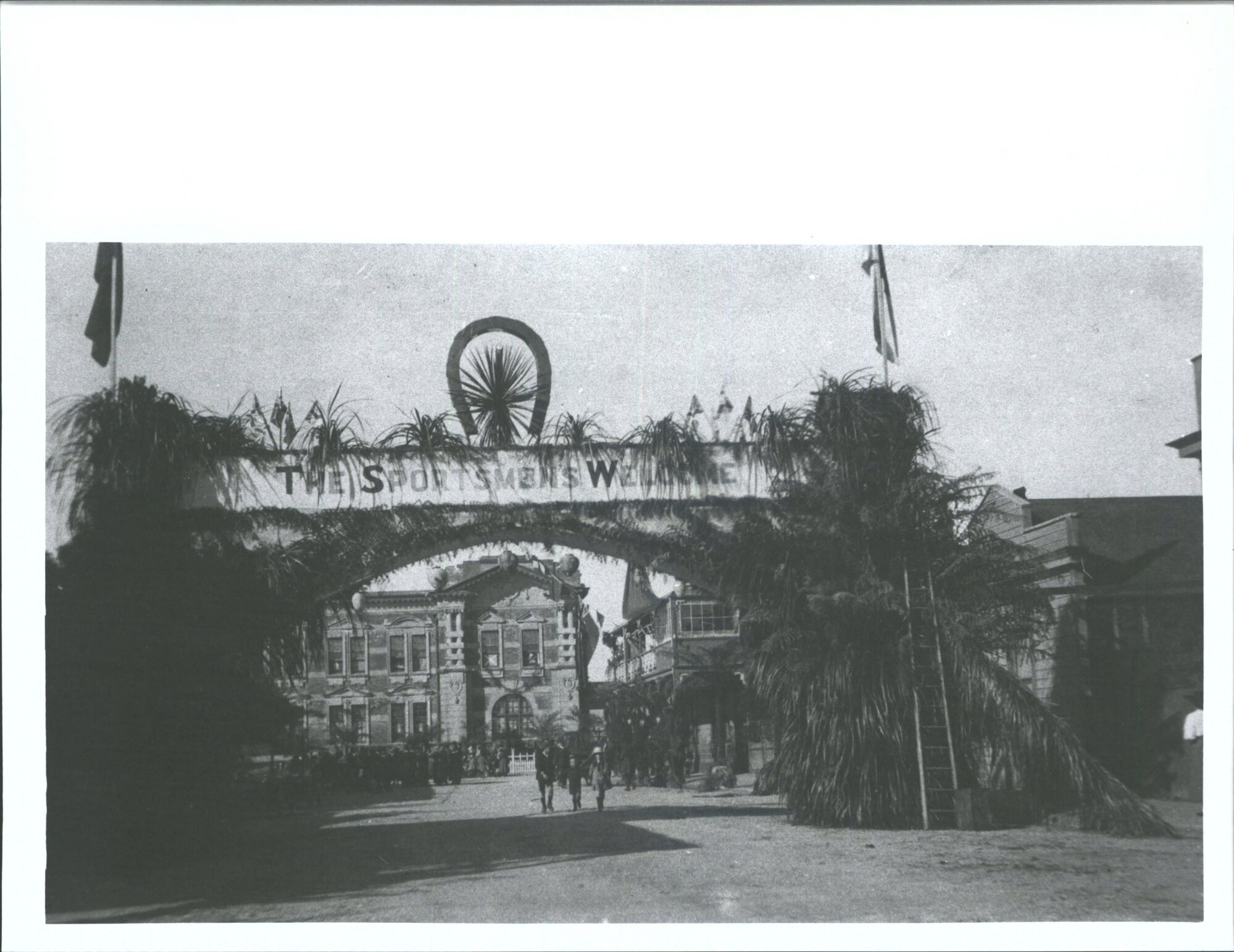 Prince of Wales visit to West Coast   "view of the decorated  arches leading to [Govt]. Building, Hokitika"