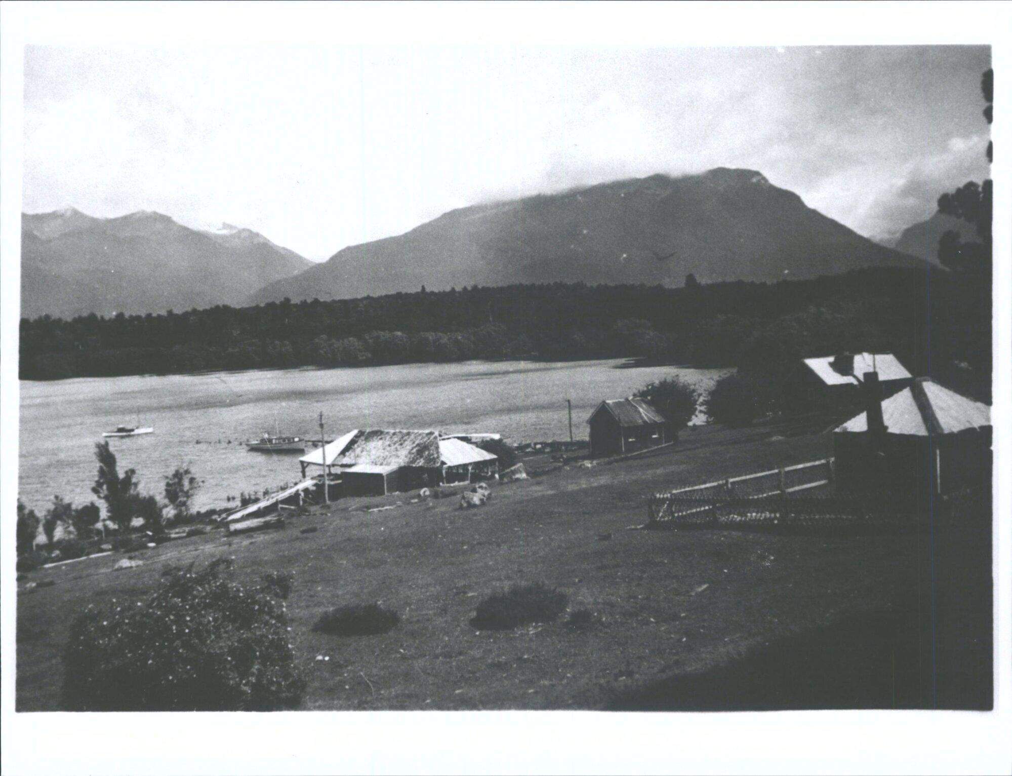 "Timber mill &amp;  station out-buildings, Lake Te Anau at the Boat Harbour, where the Eglinton Valley road leaves the lake."