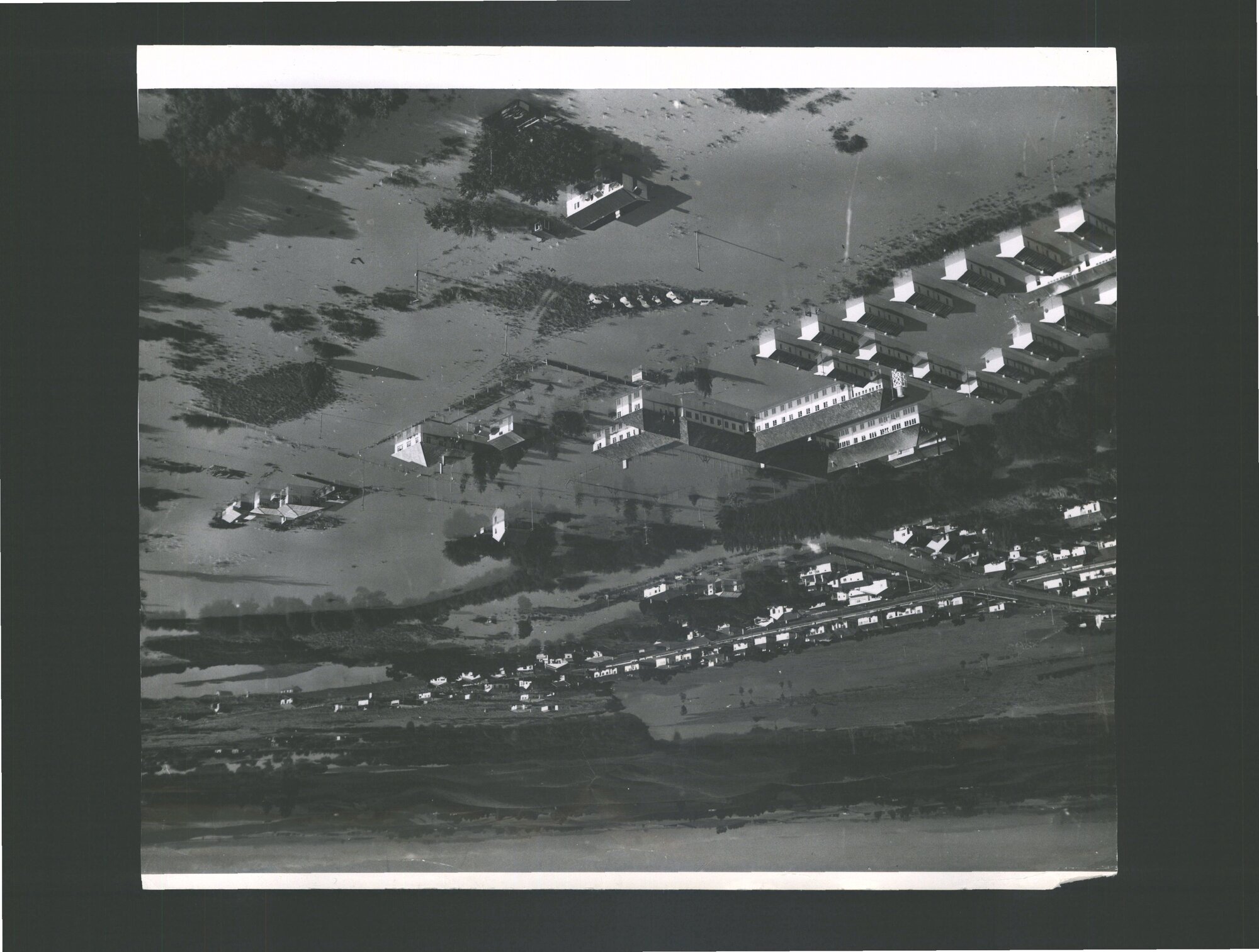 Flooded miners huts and hostel at Huntly