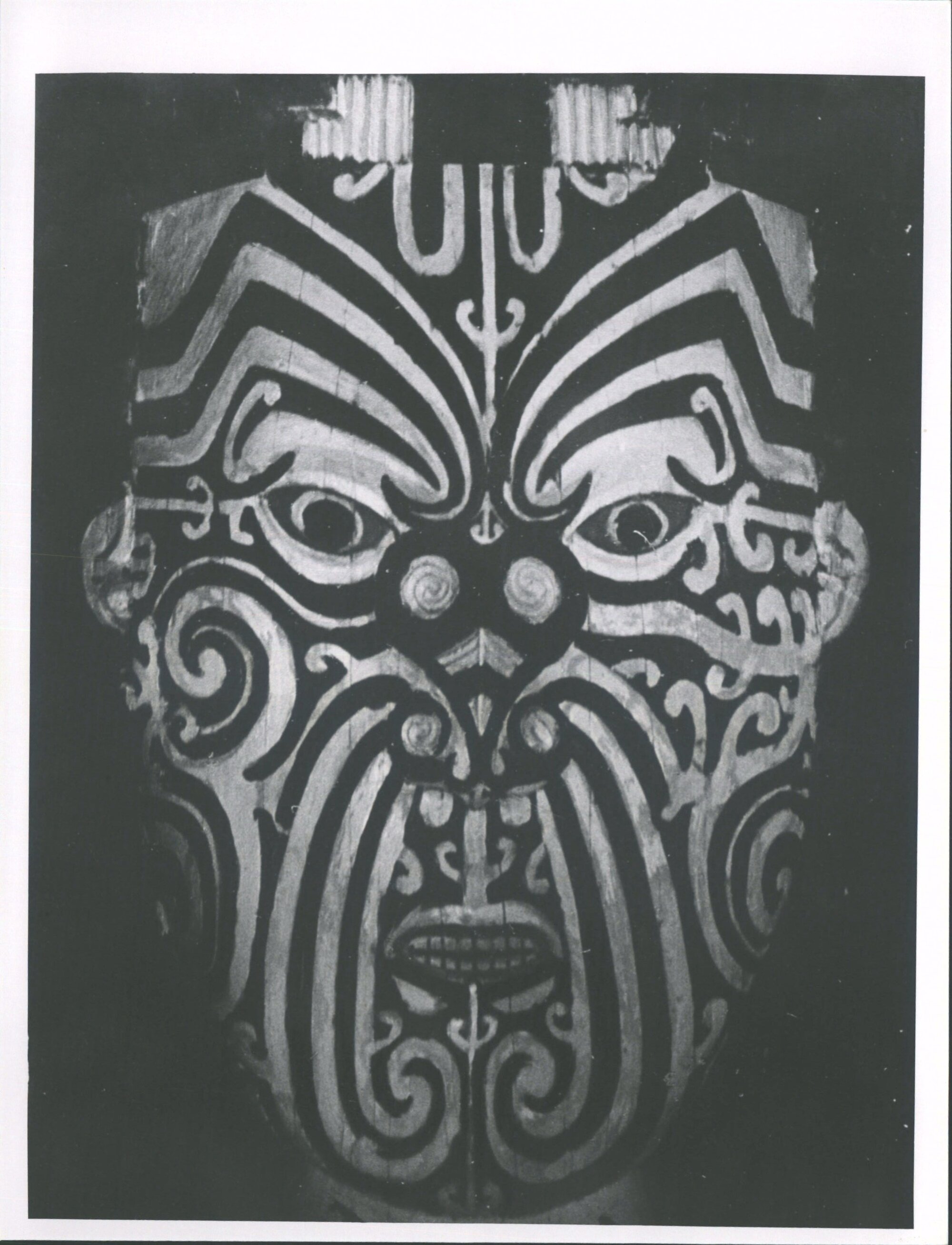 head on the ceiling inside meeting house at Ruatahuna.